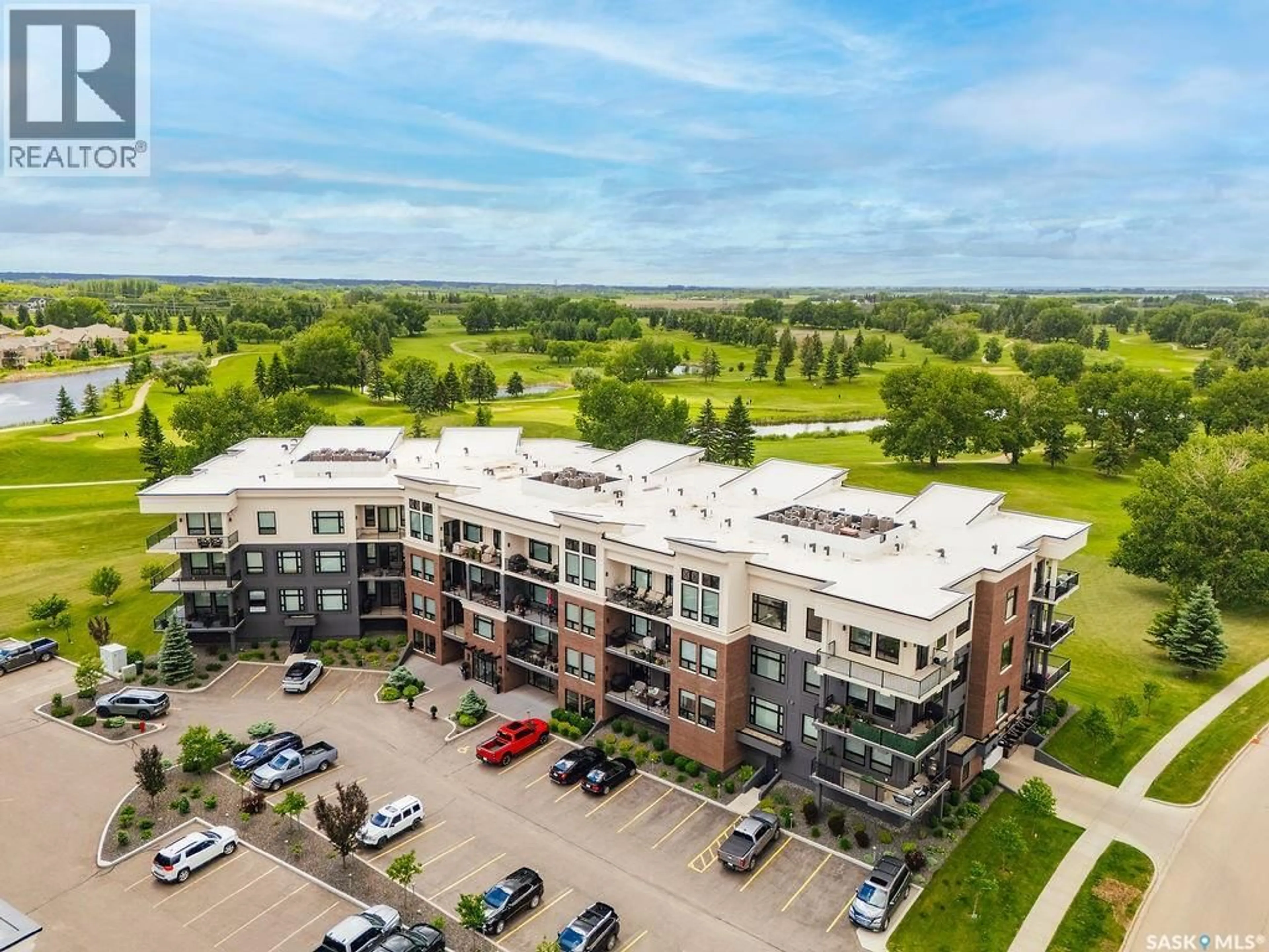 A pic from outside/outdoor area/front of a property/back of a property/a pic from drone, unknown for 404 - 107 CARTWRIGHT STREET, Saskatoon Saskatchewan S7T0W6