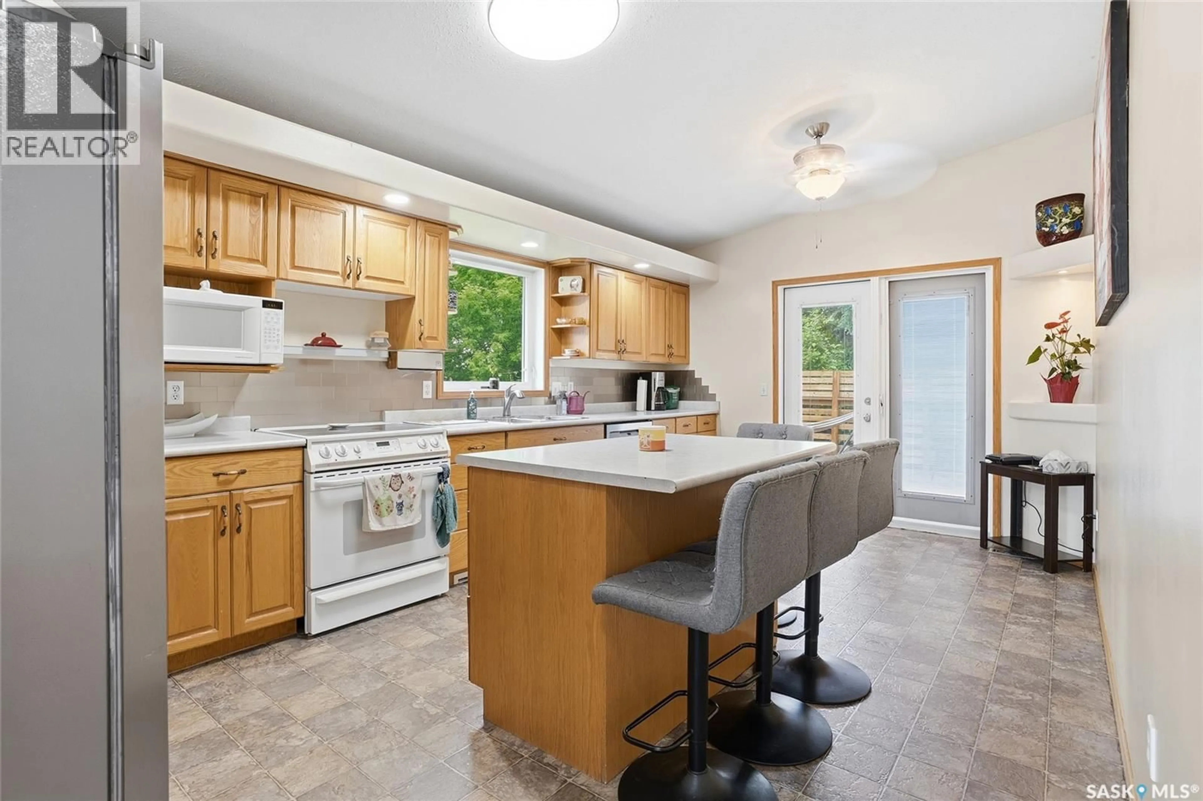 Open concept kitchen, ceramic/tile floor for 130 STRUMM TERRACE, Saskatoon Saskatchewan S7M5V4