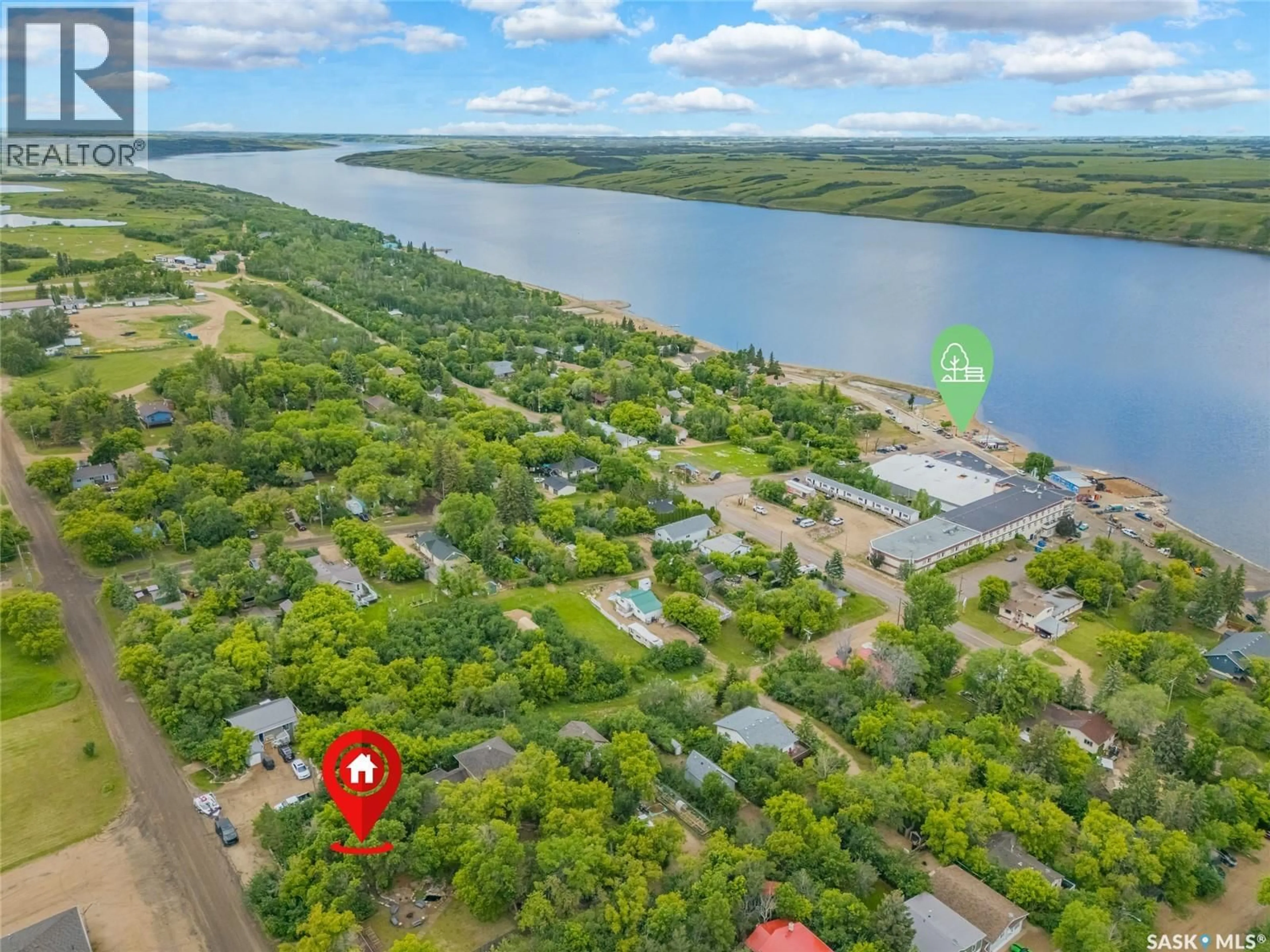 A pic from outside/outdoor area/front of a property/back of a property/a pic from drone, water/lake/river/ocean view for 215 REGINA STREET, Manitou Beach Saskatchewan S0K4T1