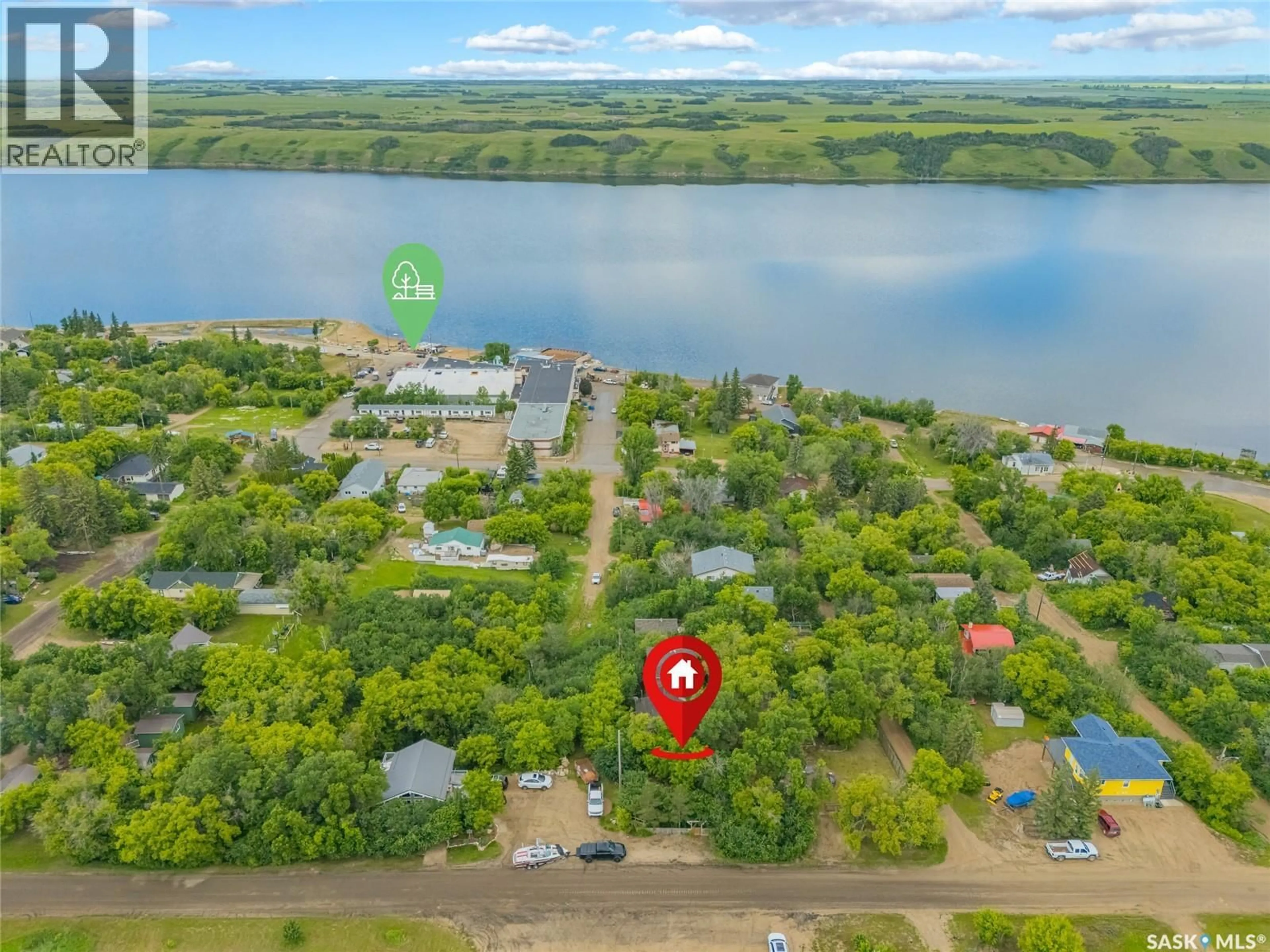 A pic from outside/outdoor area/front of a property/back of a property/a pic from drone, water/lake/river/ocean view for 215 REGINA STREET, Manitou Beach Saskatchewan S0K4T1