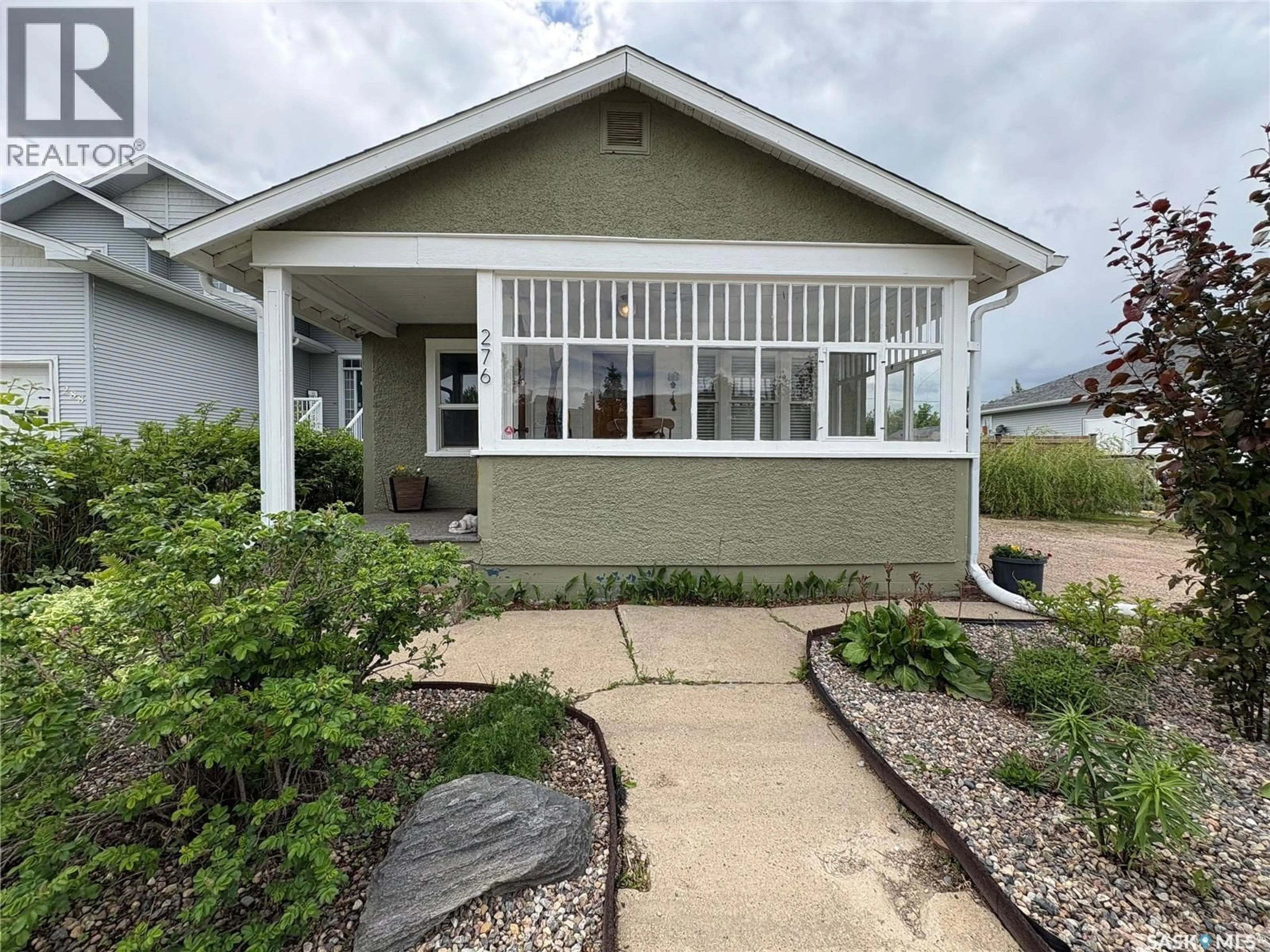 Home with vinyl exterior material, street for 276 2ND AVENUE E, Unity Saskatchewan S0K4L0