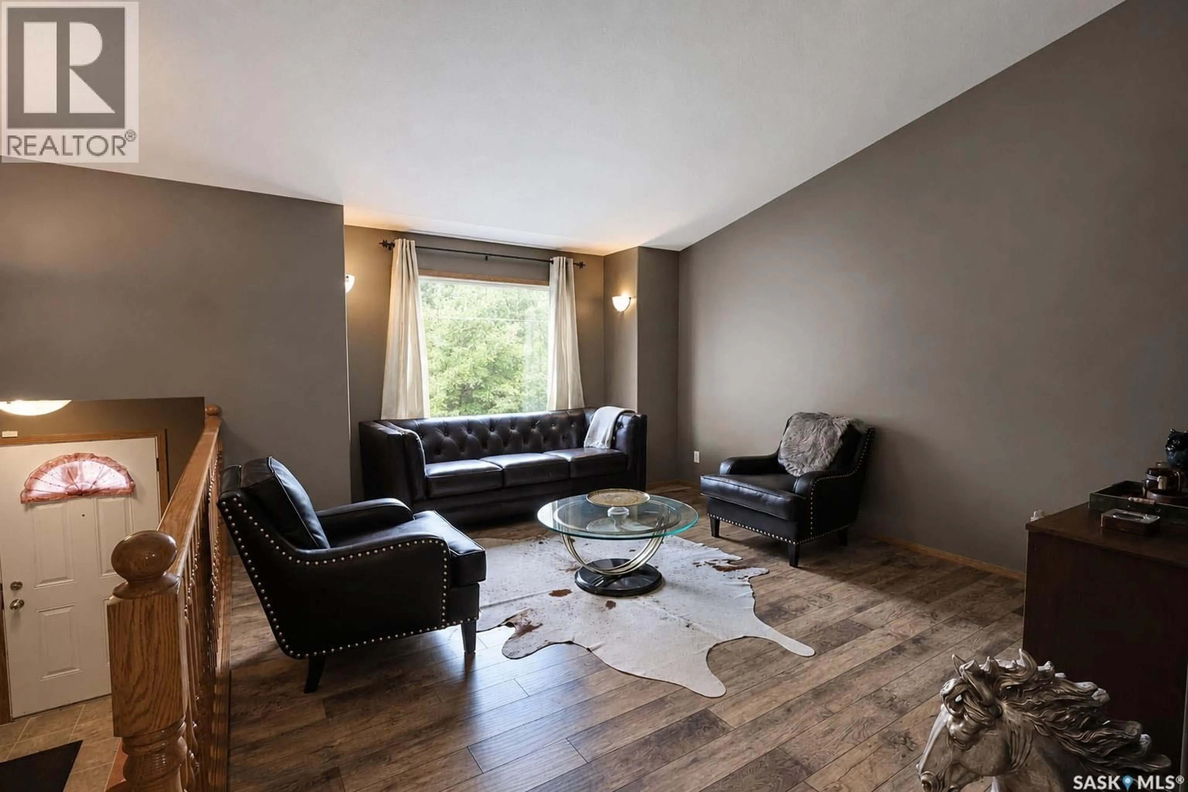 Living room with furniture, wood/laminate floor for 3143 WEIR ROAD, Prince Albert Saskatchewan S6V0A5