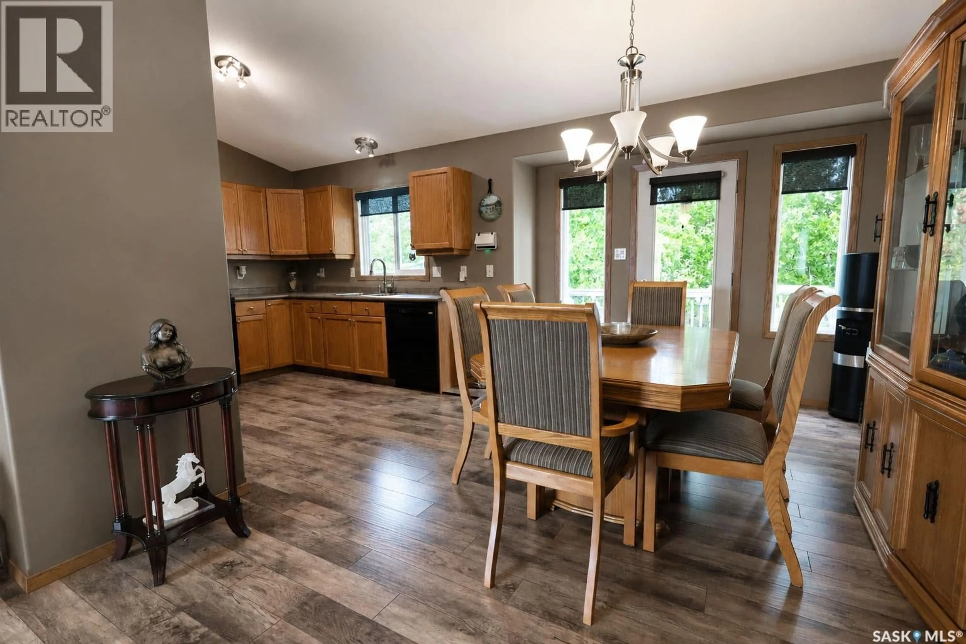 Open concept kitchen, wood/laminate floor for 3143 WEIR ROAD, Prince Albert Saskatchewan S6V0A5