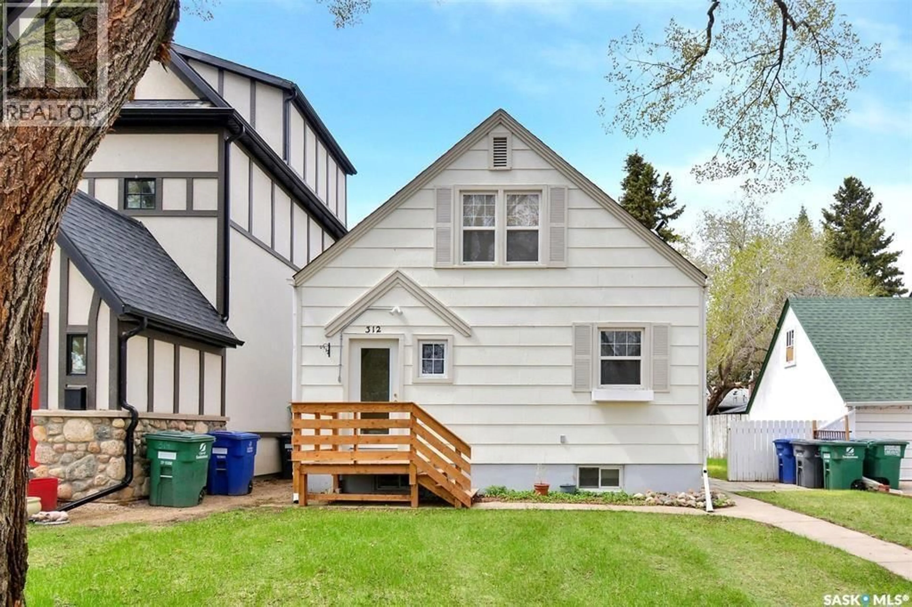 Home with vinyl exterior material, street for 312 MCKINNON AVENUE, Saskatoon Saskatchewan S7N1J6