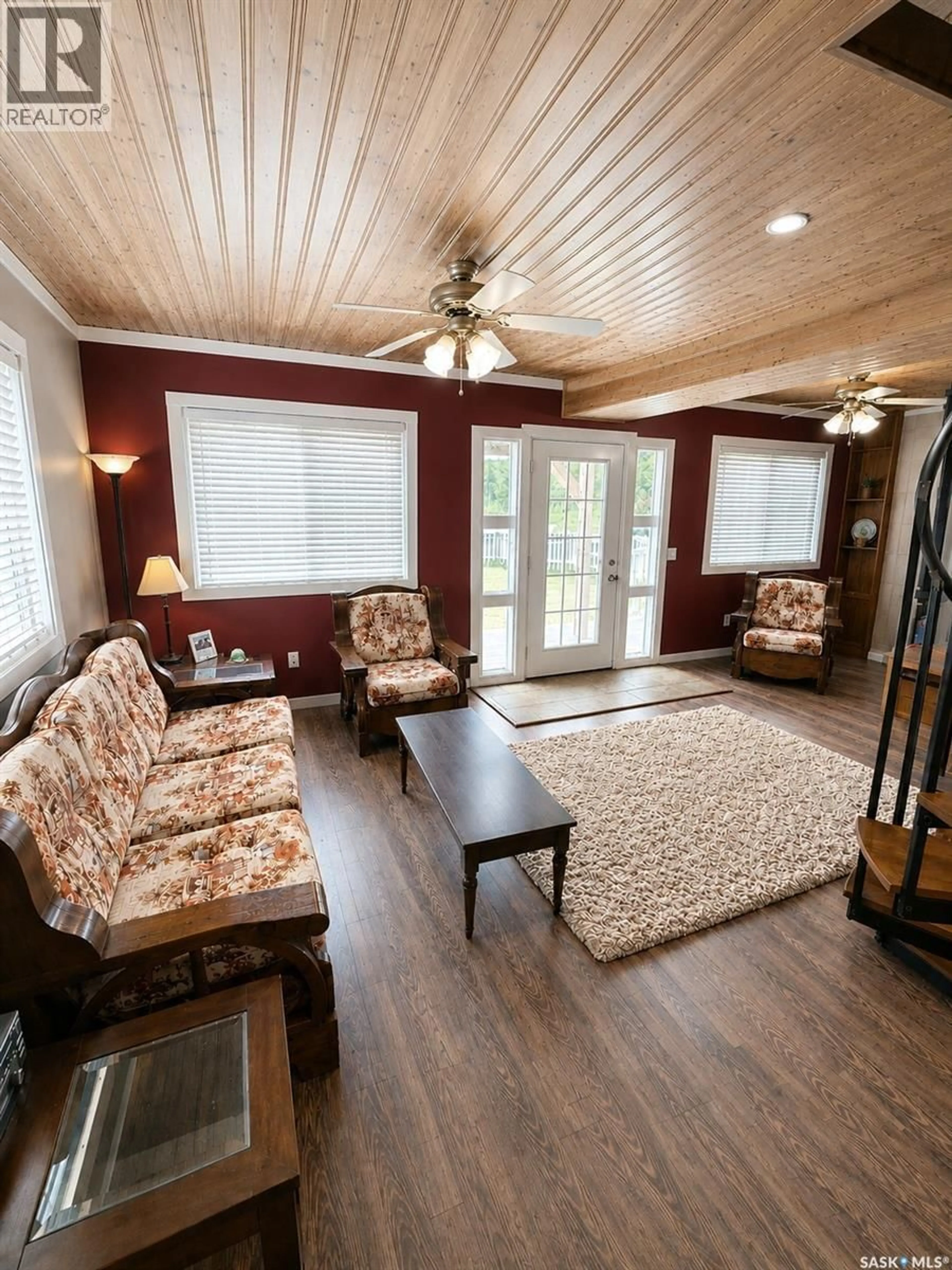 Living room with furniture, wood/laminate floor for 201 & 202 ELIM DRIVE, Lac Pelletier Saskatchewan S0N2Y0