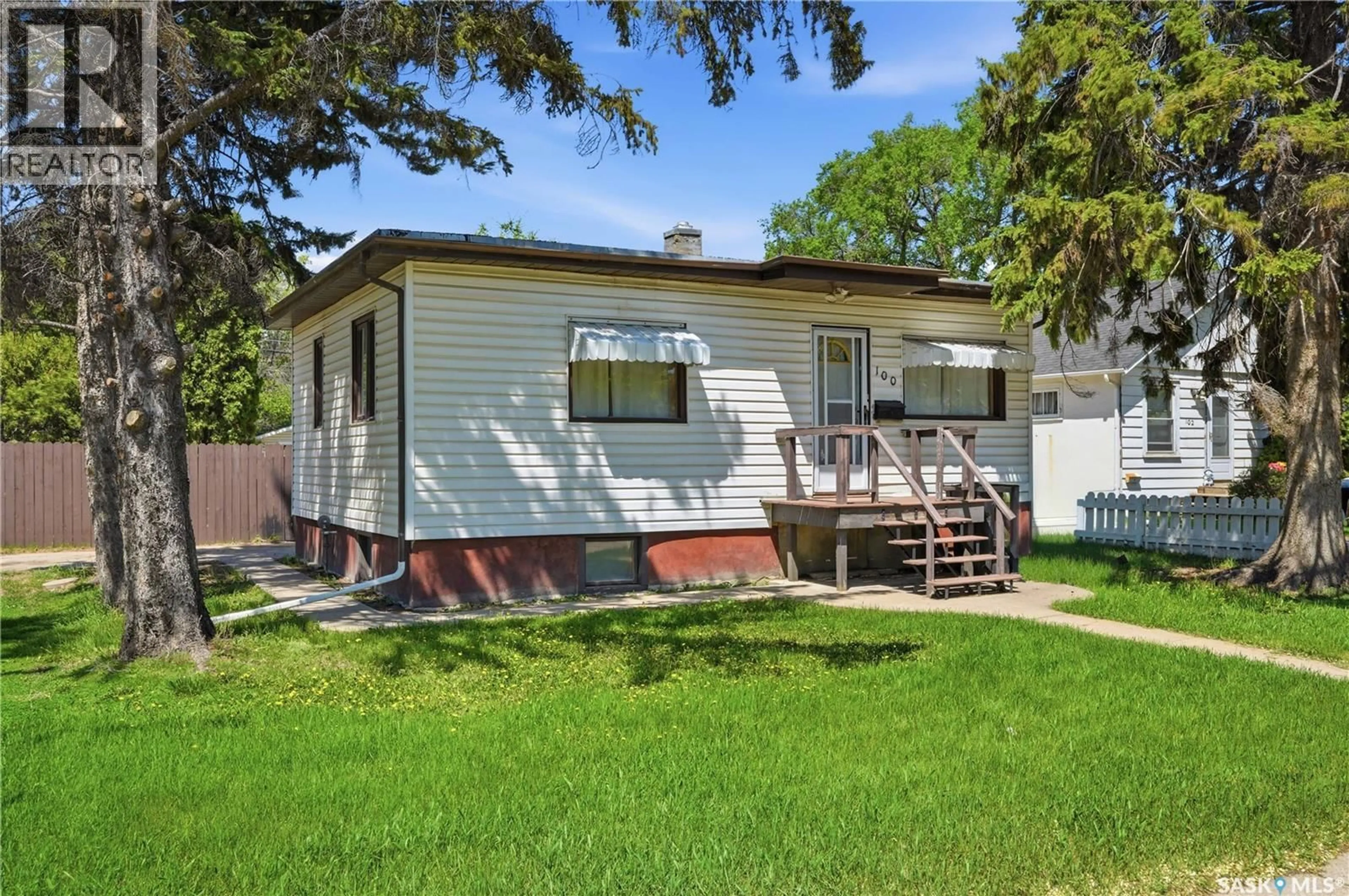 Home with vinyl exterior material, street for 100 CRUISE STREET, Saskatoon Saskatchewan S7N2C1