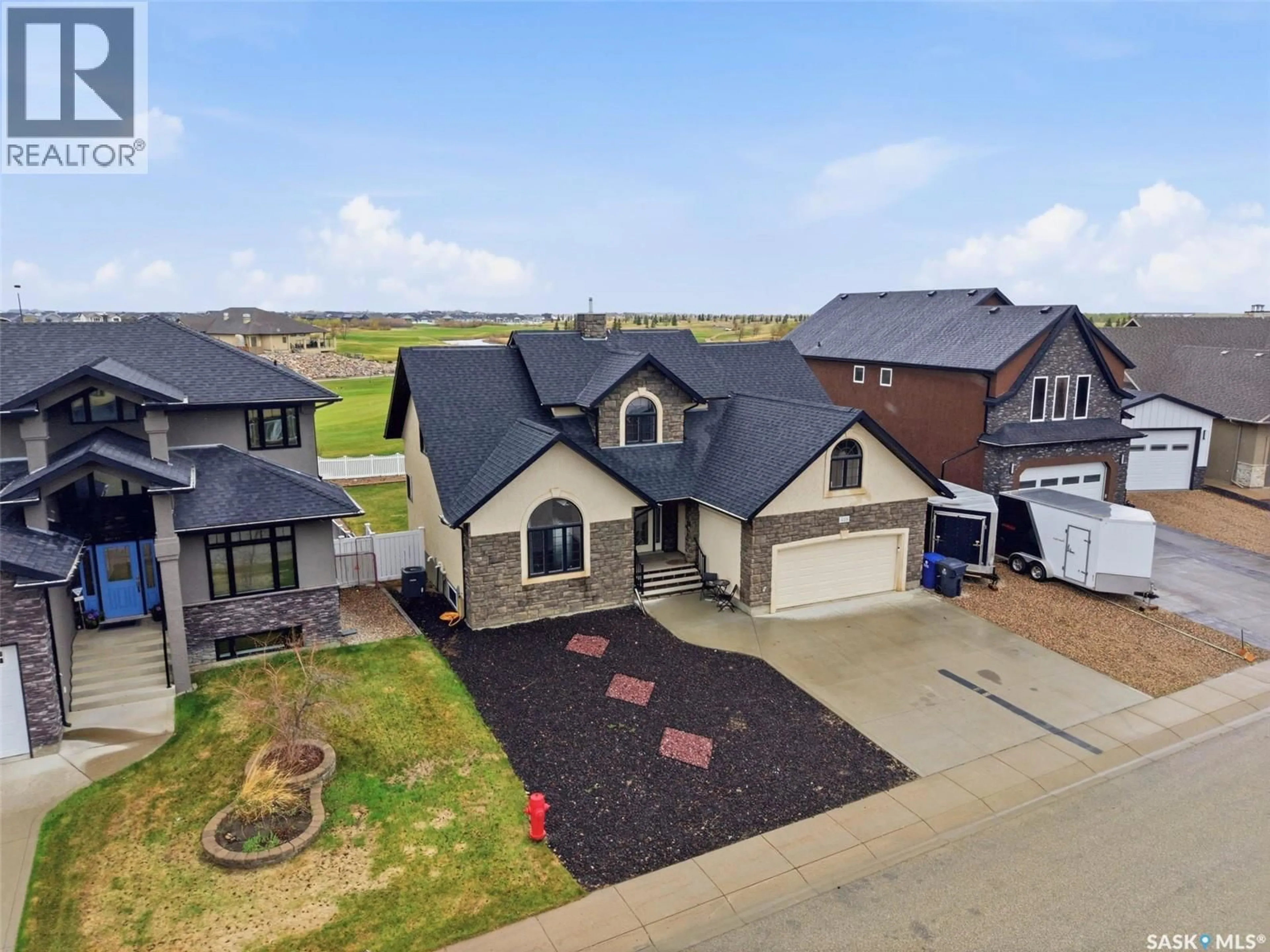 A pic from outside/outdoor area/front of a property/back of a property/a pic from drone, street for 418 NICKLAUS DRIVE, Warman Saskatchewan S0K4S0