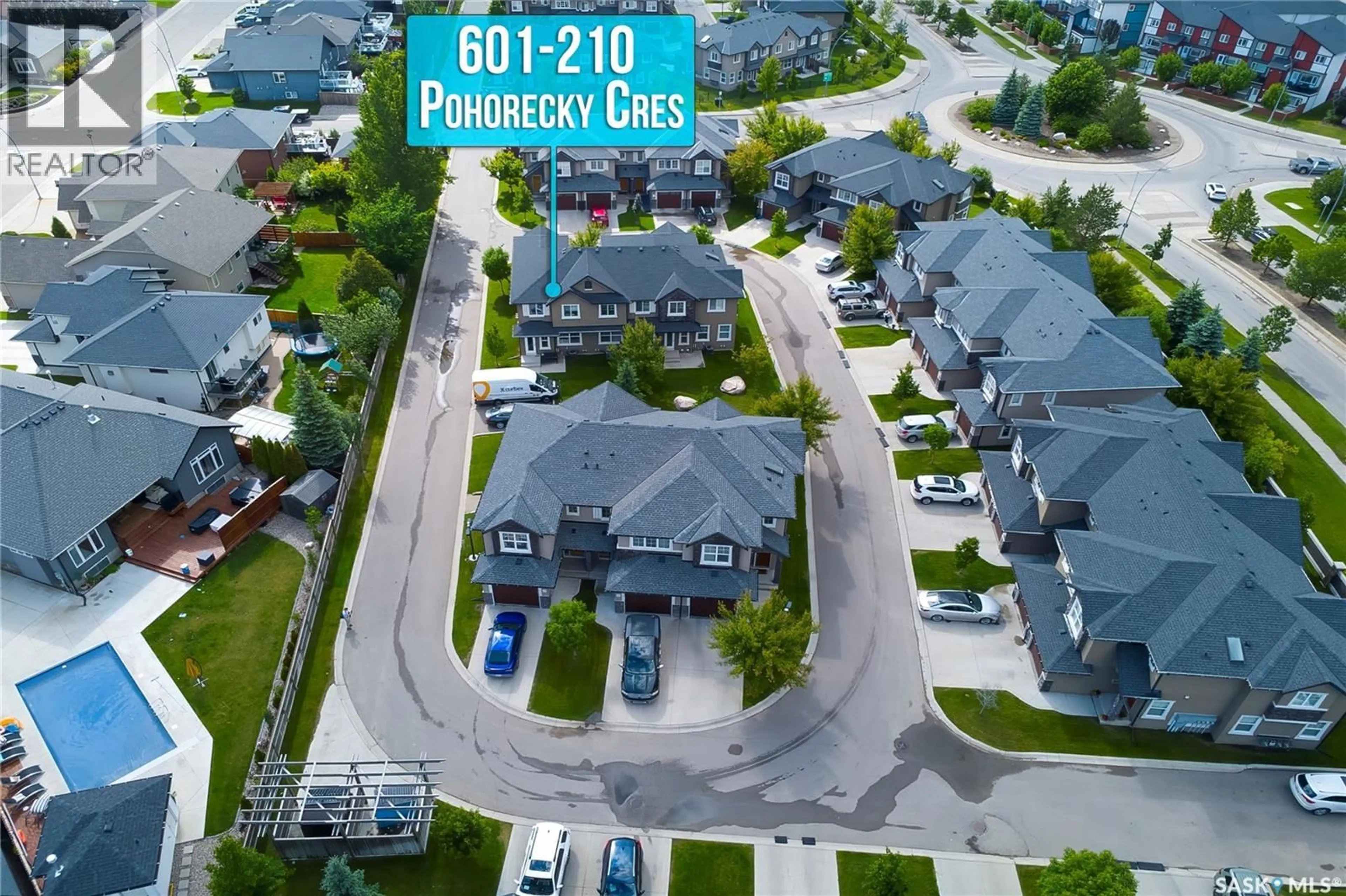A pic from outside/outdoor area/front of a property/back of a property/a pic from drone, street for 2012 - 601 POHORECKY CRESCENT, Saskatoon Saskatchewan S7W0V4