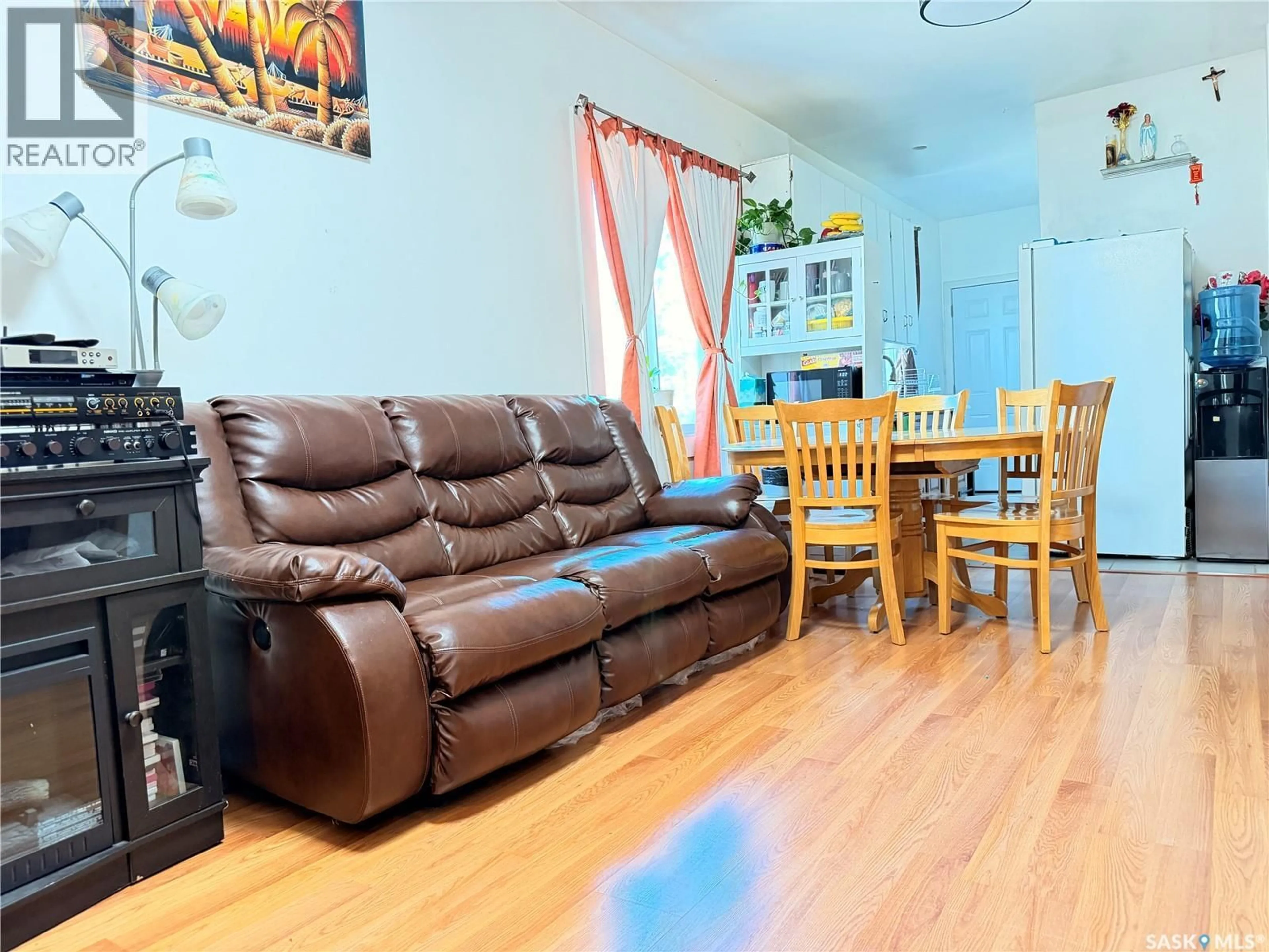 Living room with furniture, wood/laminate floor for 1340 RETALLACK STREET, Regina Saskatchewan S4T2H9