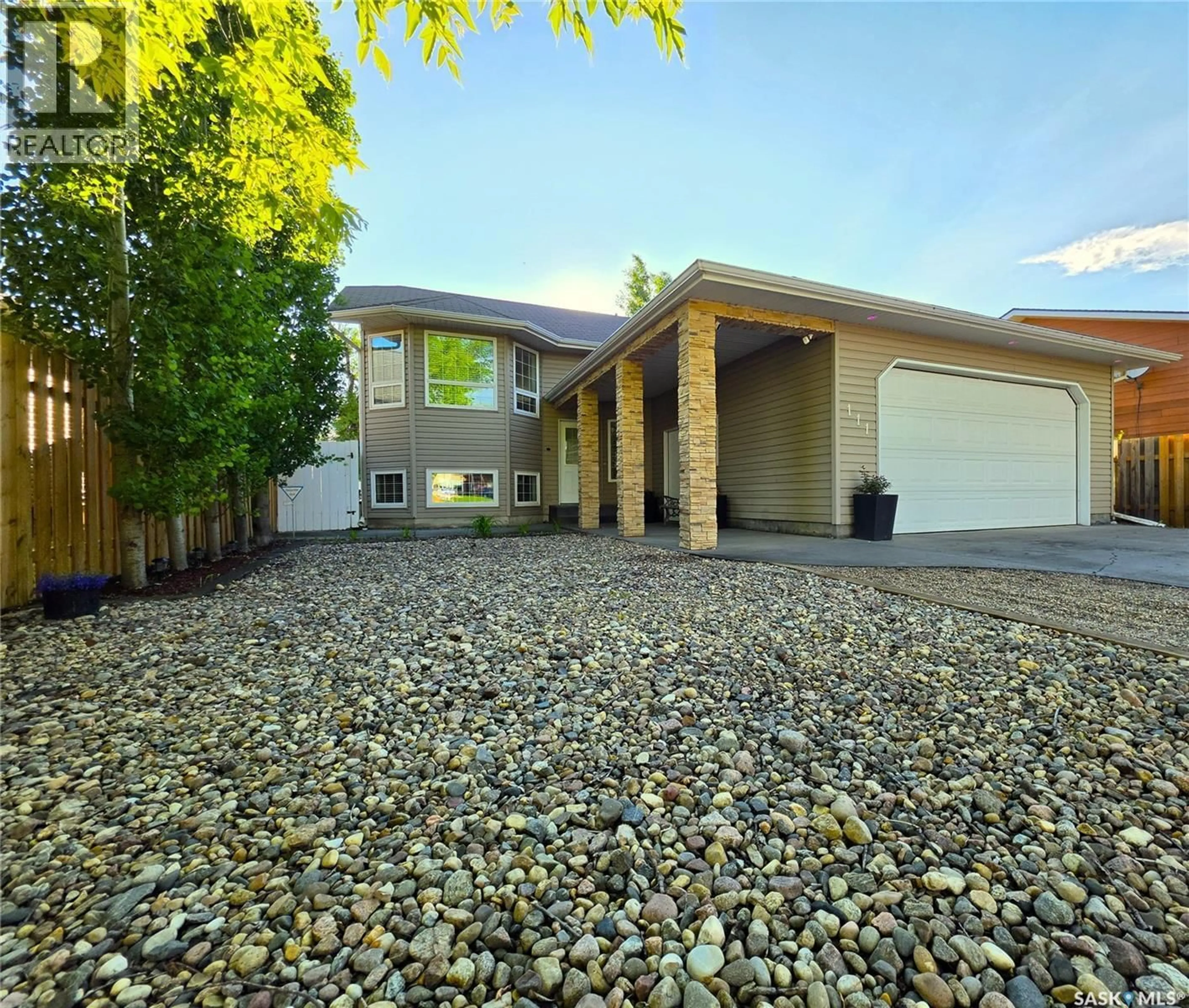 Home with vinyl exterior material, street for 111 2ND STREET, Meadow Lake Saskatchewan S9X1G4