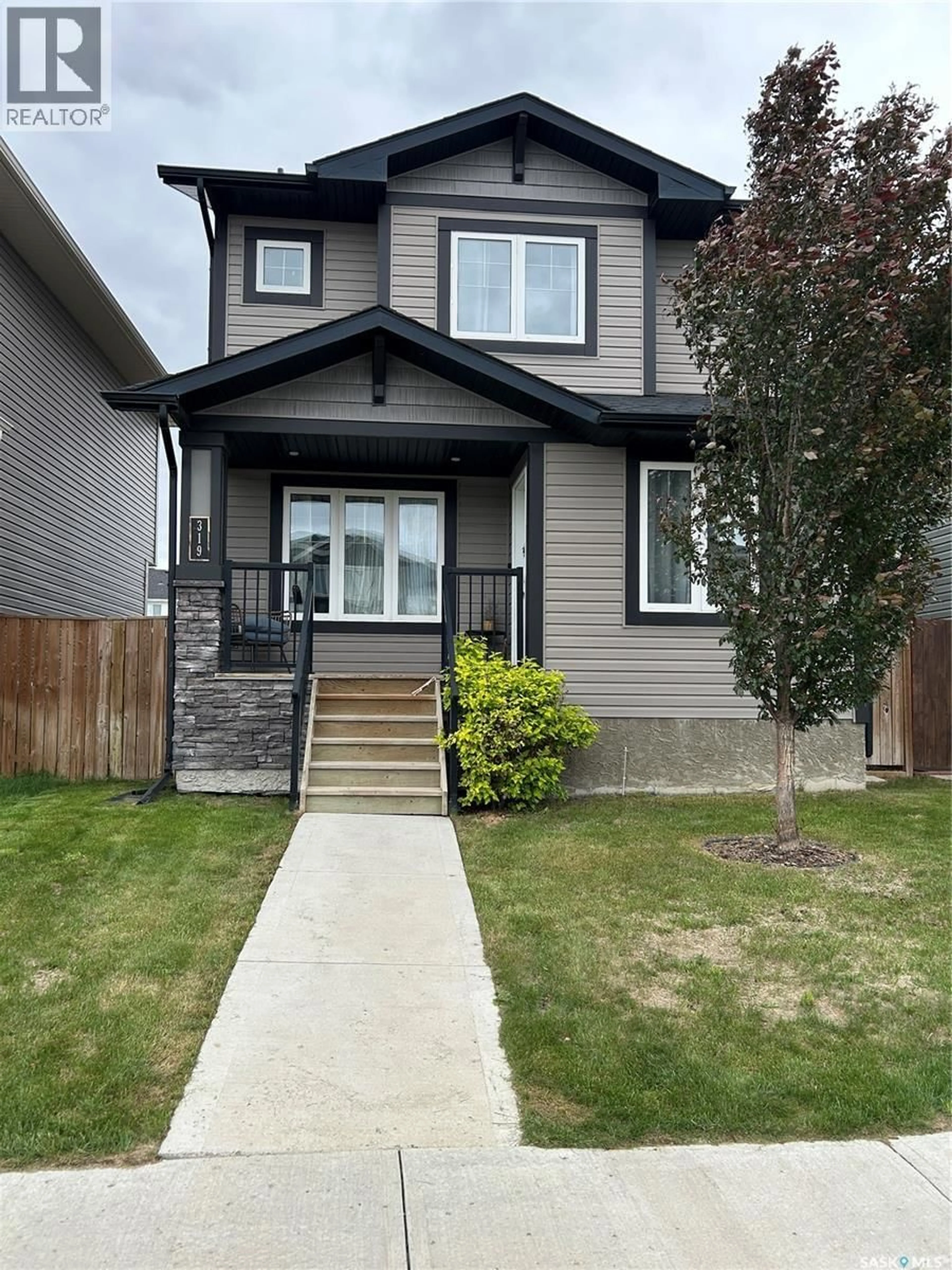 Home with vinyl exterior material, street for 319 SECORD WAY, Saskatoon Saskatchewan S7V0L9