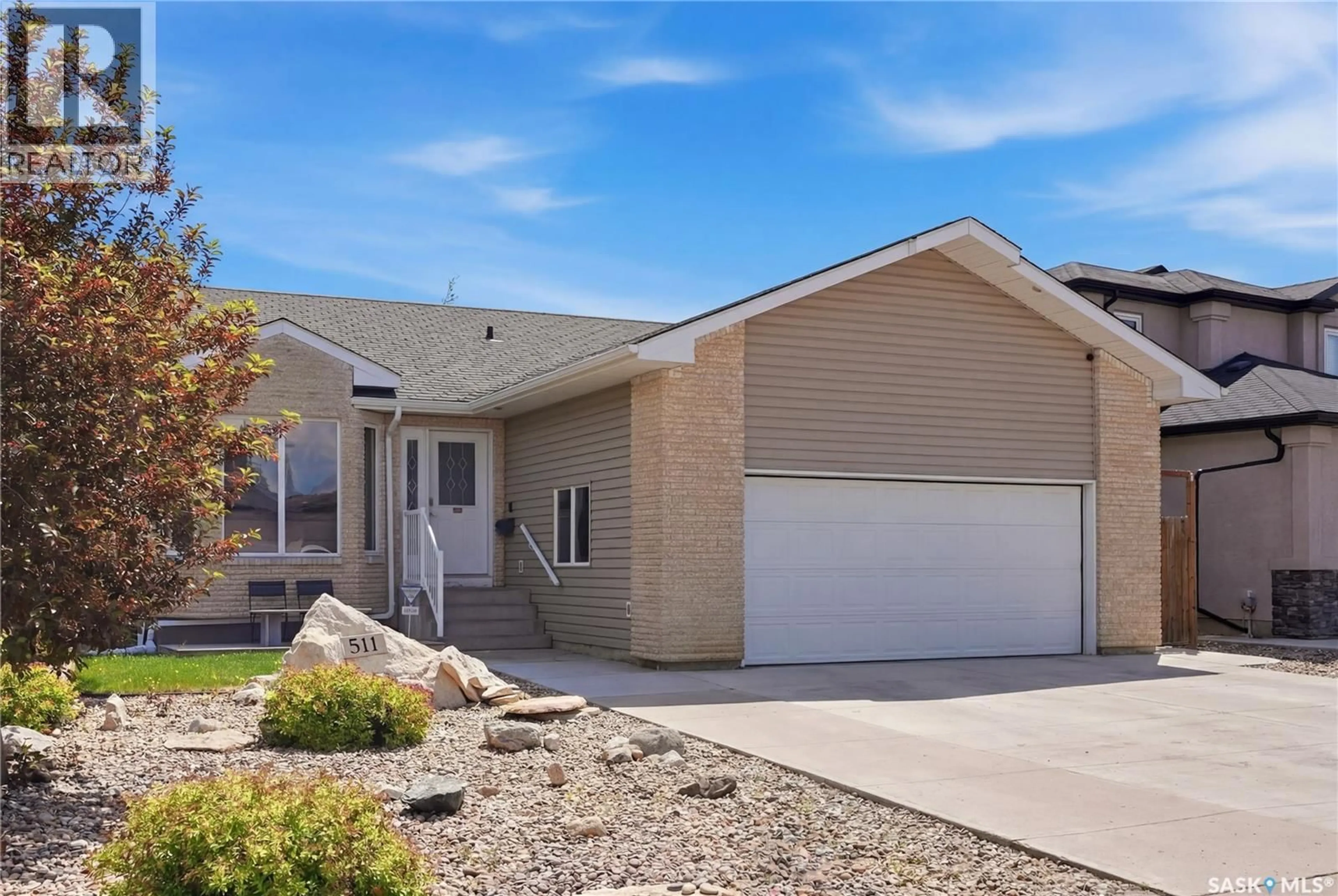 Home with vinyl exterior material, street for 511 HAMPTON BOULEVARD, Saskatoon Saskatchewan S7R0B4