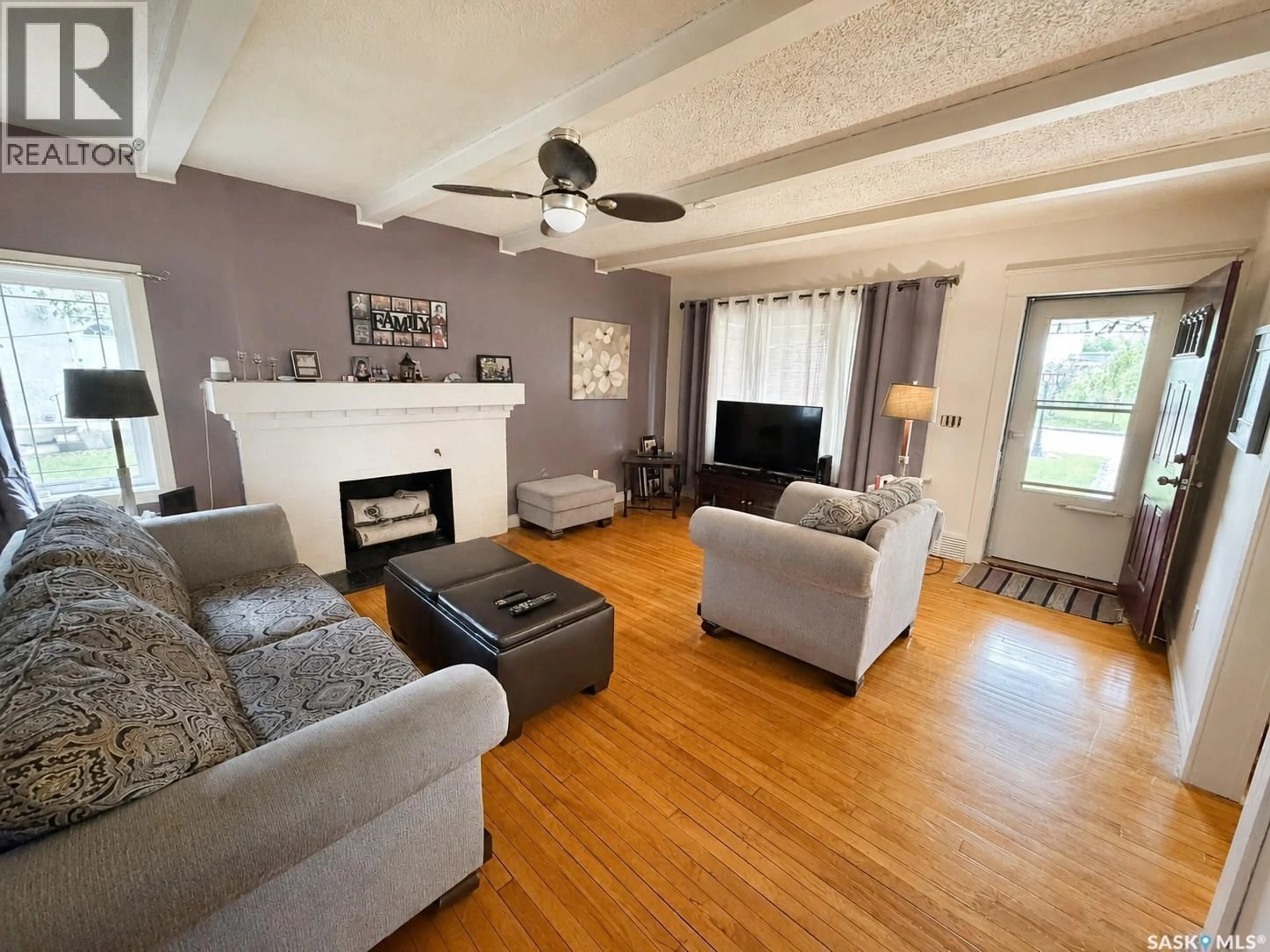 Living room with furniture, wood/laminate floor for 1174 CONRAD AVENUE, Gull Lake Saskatchewan S0N1A0