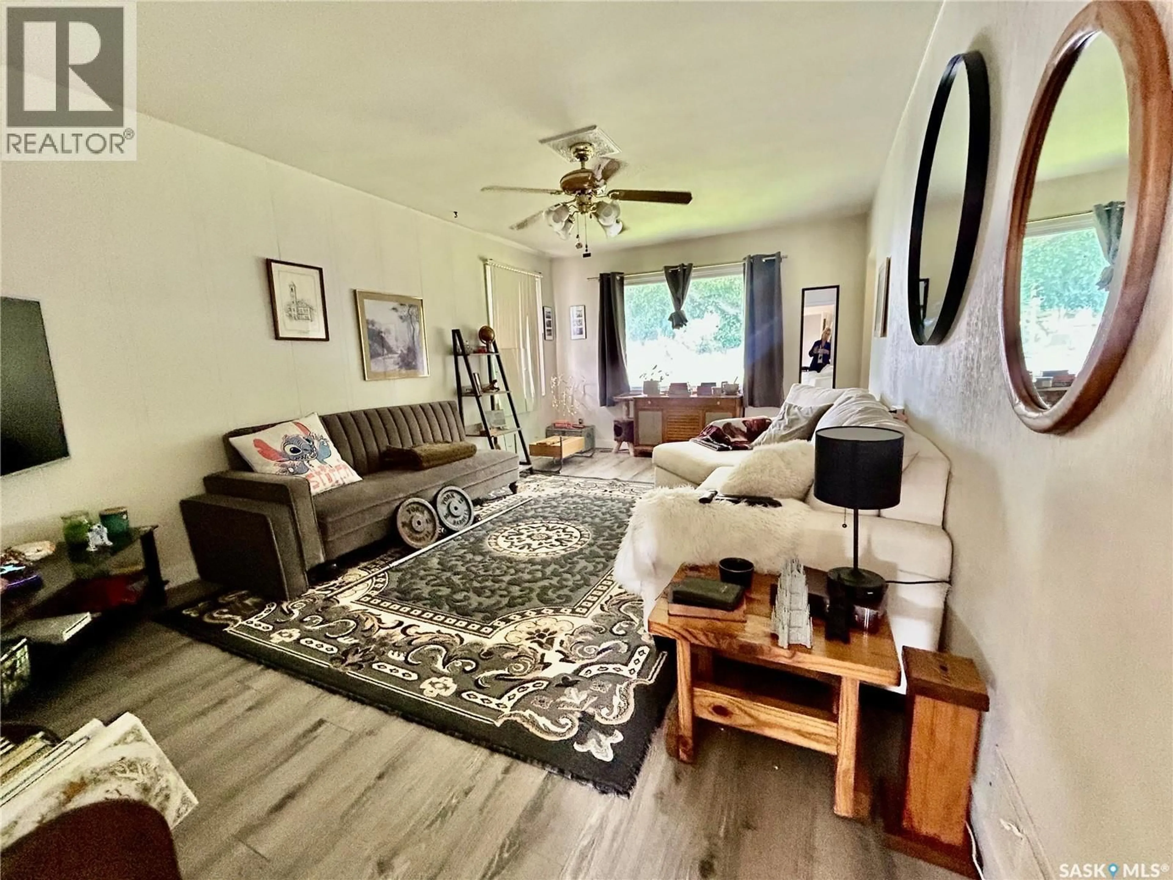 Living room with furniture, wood/laminate floor for 2200 FRANCIS STREET, Regina Saskatchewan S4N2P5