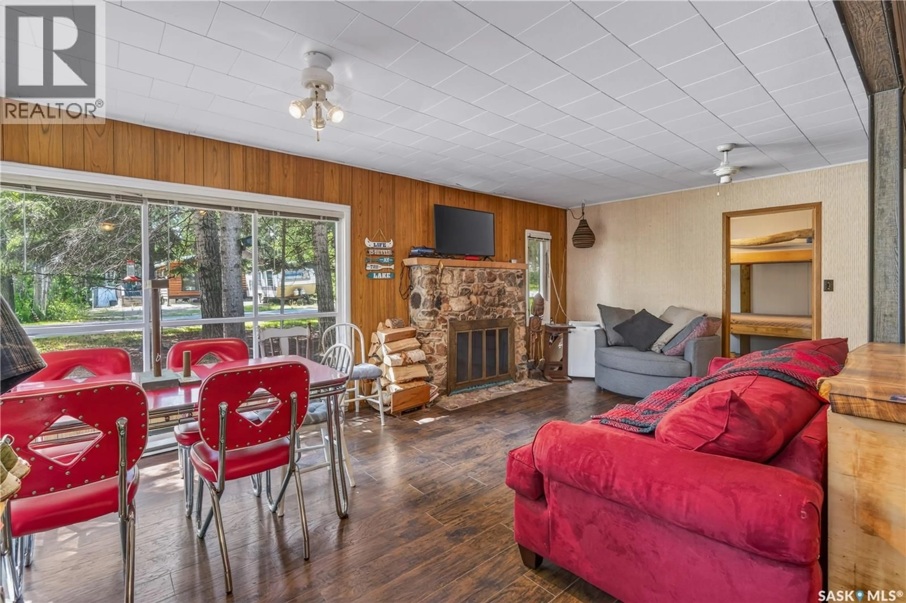 Living room with furniture, wood/laminate floor for 12 MALLARD AVENUE, Greenwater Provincial Park Saskatchewan S0E0B2