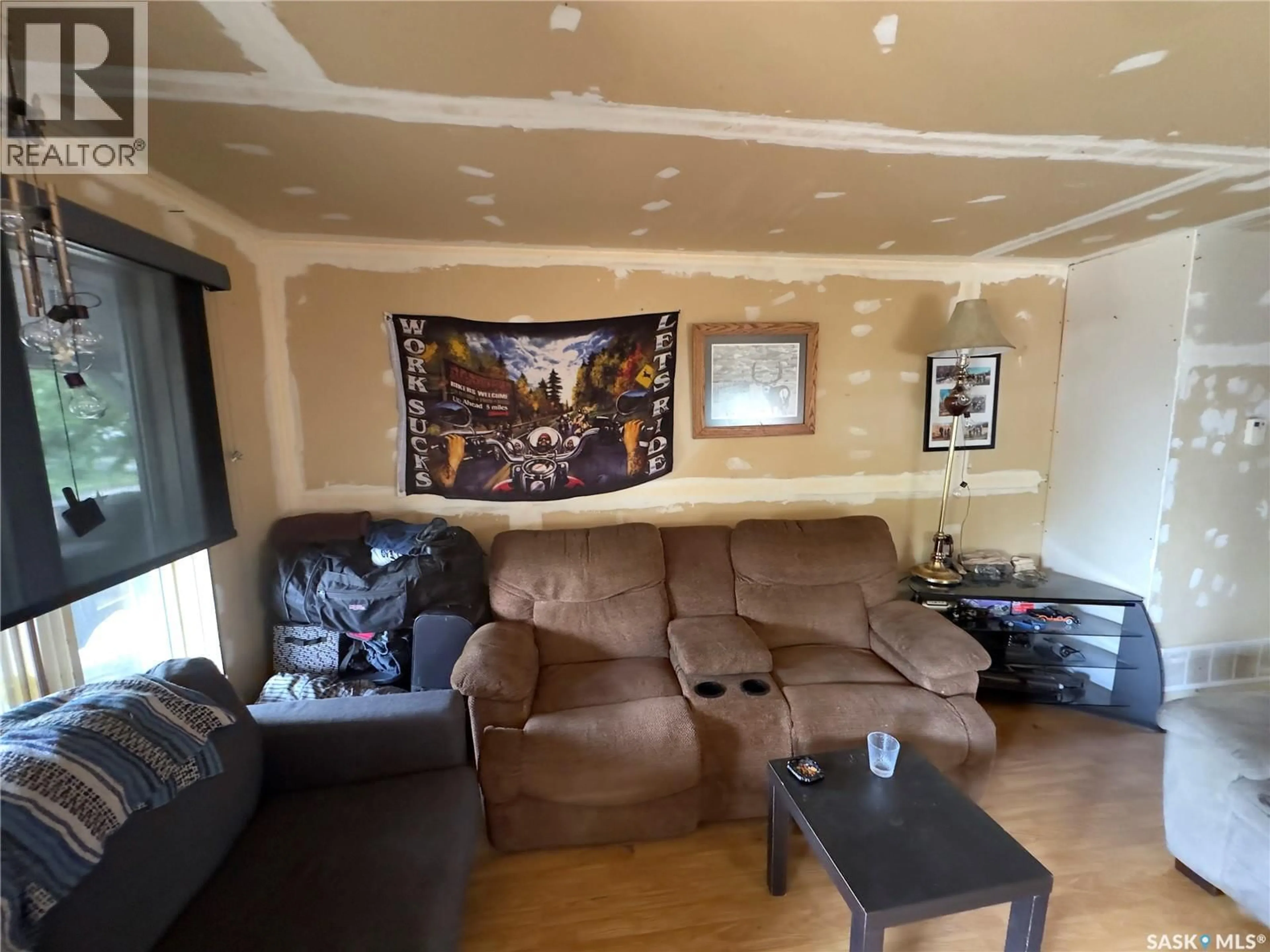 Living room with furniture, wood/laminate floor for 1010 ATHABASCA STREET, Moose Jaw Saskatchewan S6H0N2