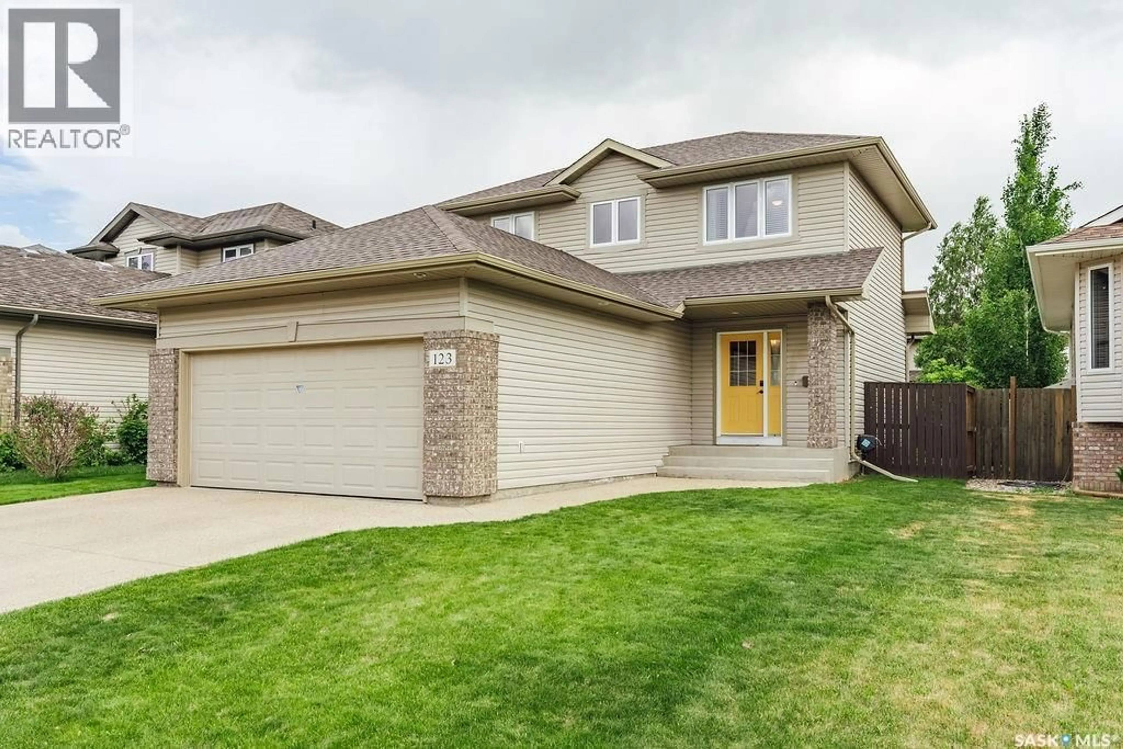 Home with brick exterior material, street for 123 BORLASE COVE, Saskatoon Saskatchewan S7T0B7