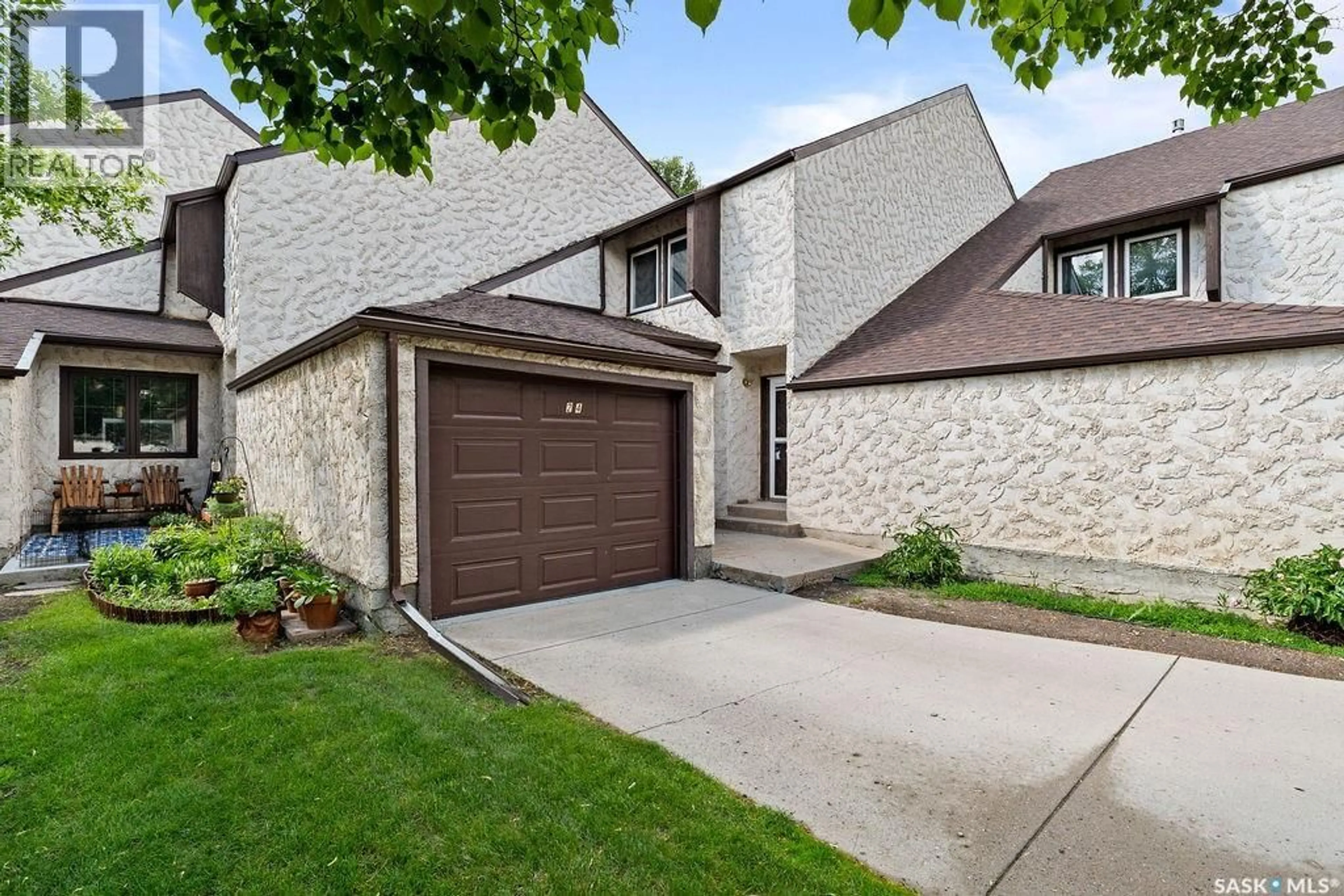 Home with brick exterior material, street for 24 CANNINGTON MEWS, Regina Saskatchewan S4S5Z7