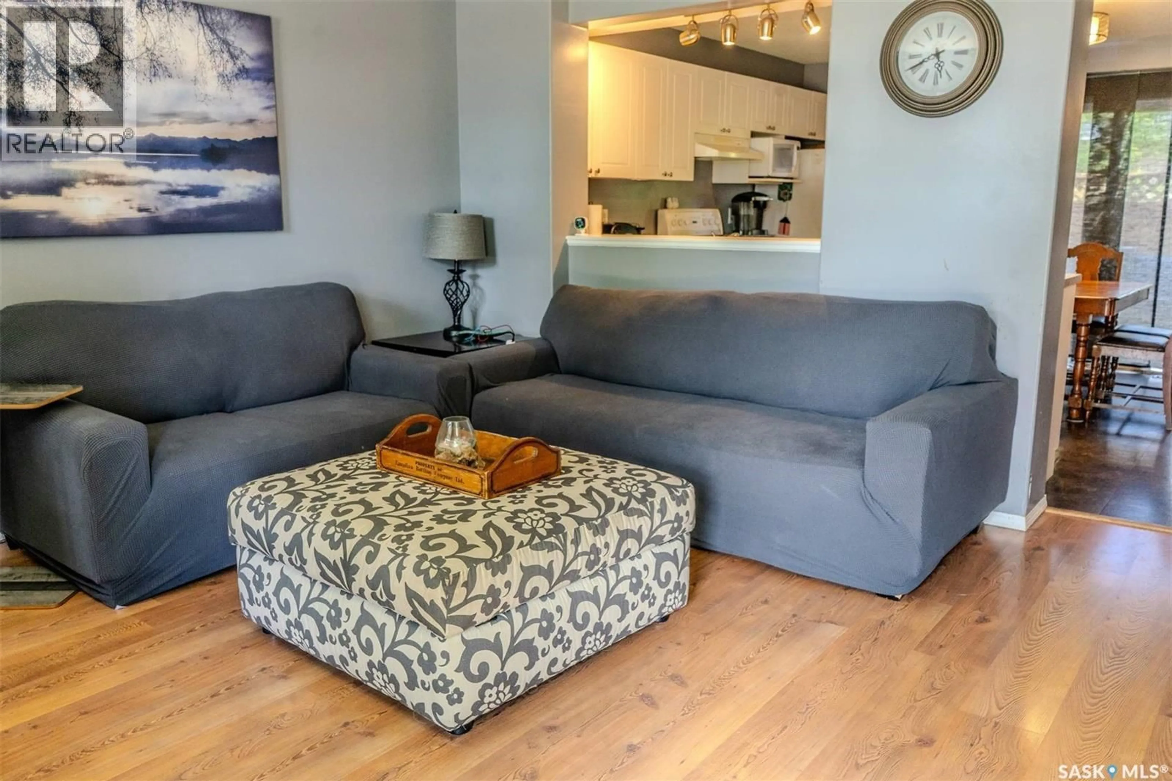 Living room with furniture, wood/laminate floor for 1430 10TH AVENUE, Regina Saskatchewan S4N7P6