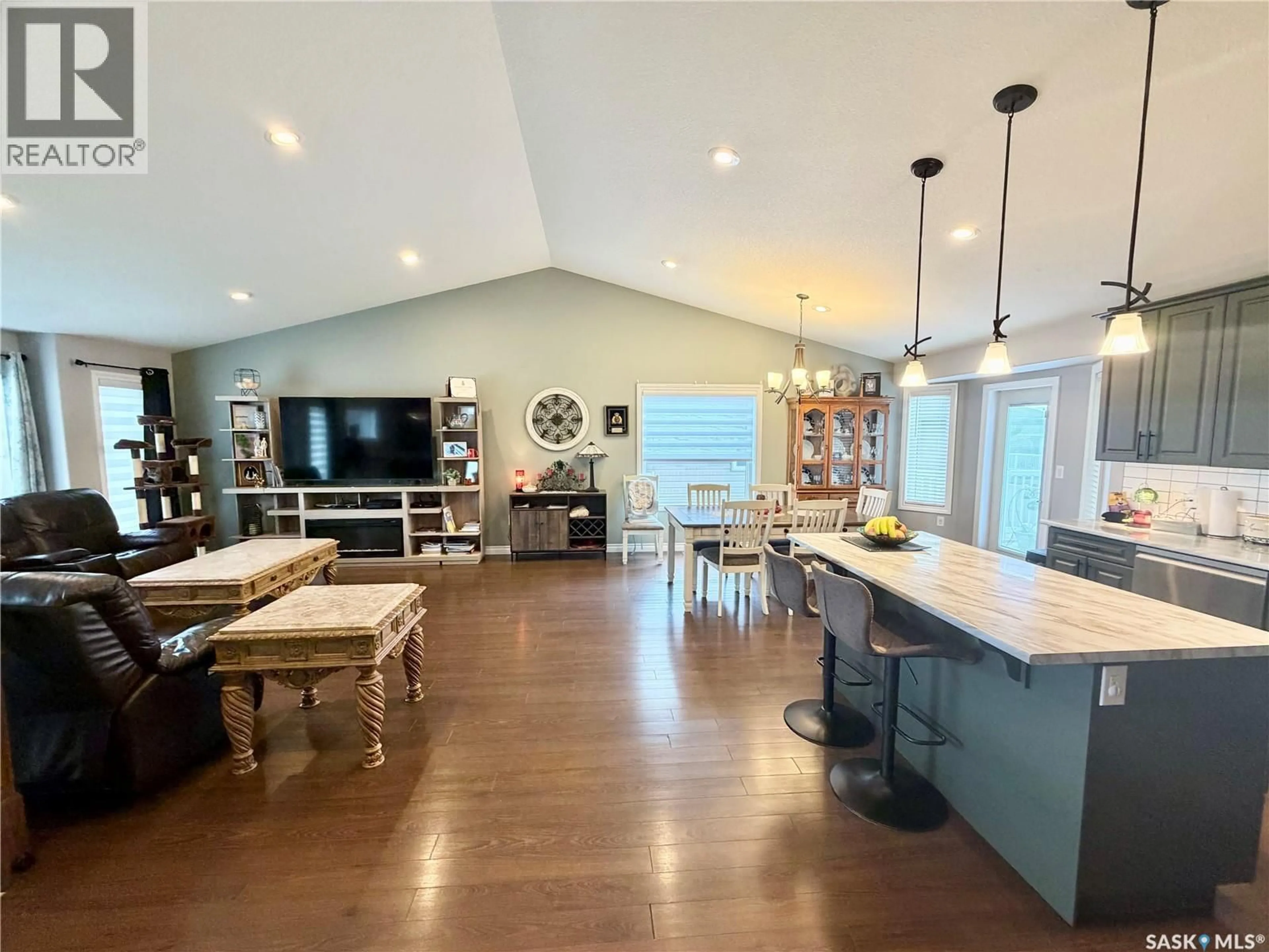Open concept kitchen, wood/laminate floor for 2326 BUHLER BAY, North Battleford Saskatchewan S9A1J2