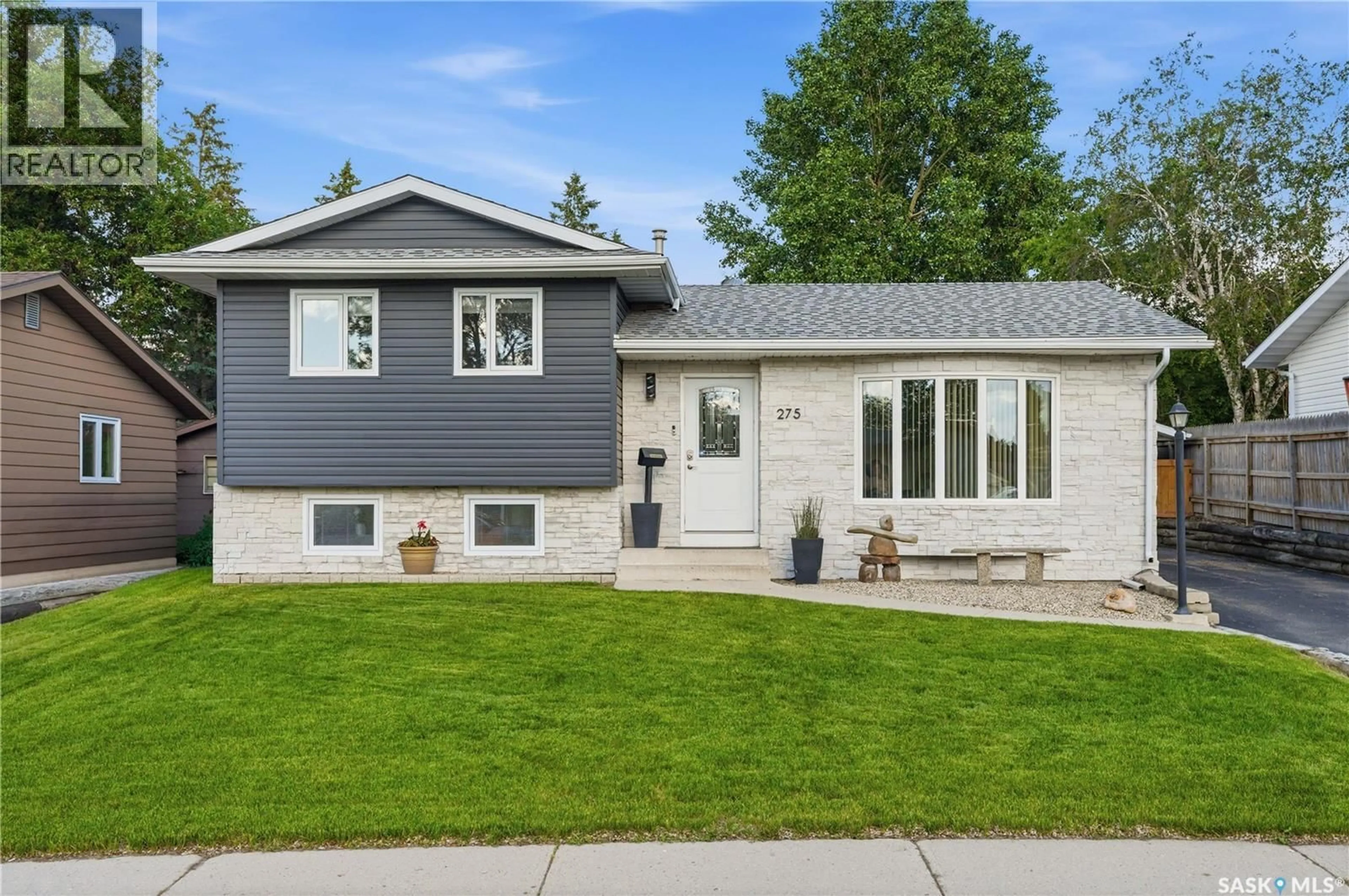 Home with vinyl exterior material, street for 275 WRIGLEY CRESCENT, Saskatoon Saskatchewan S7M4Y3