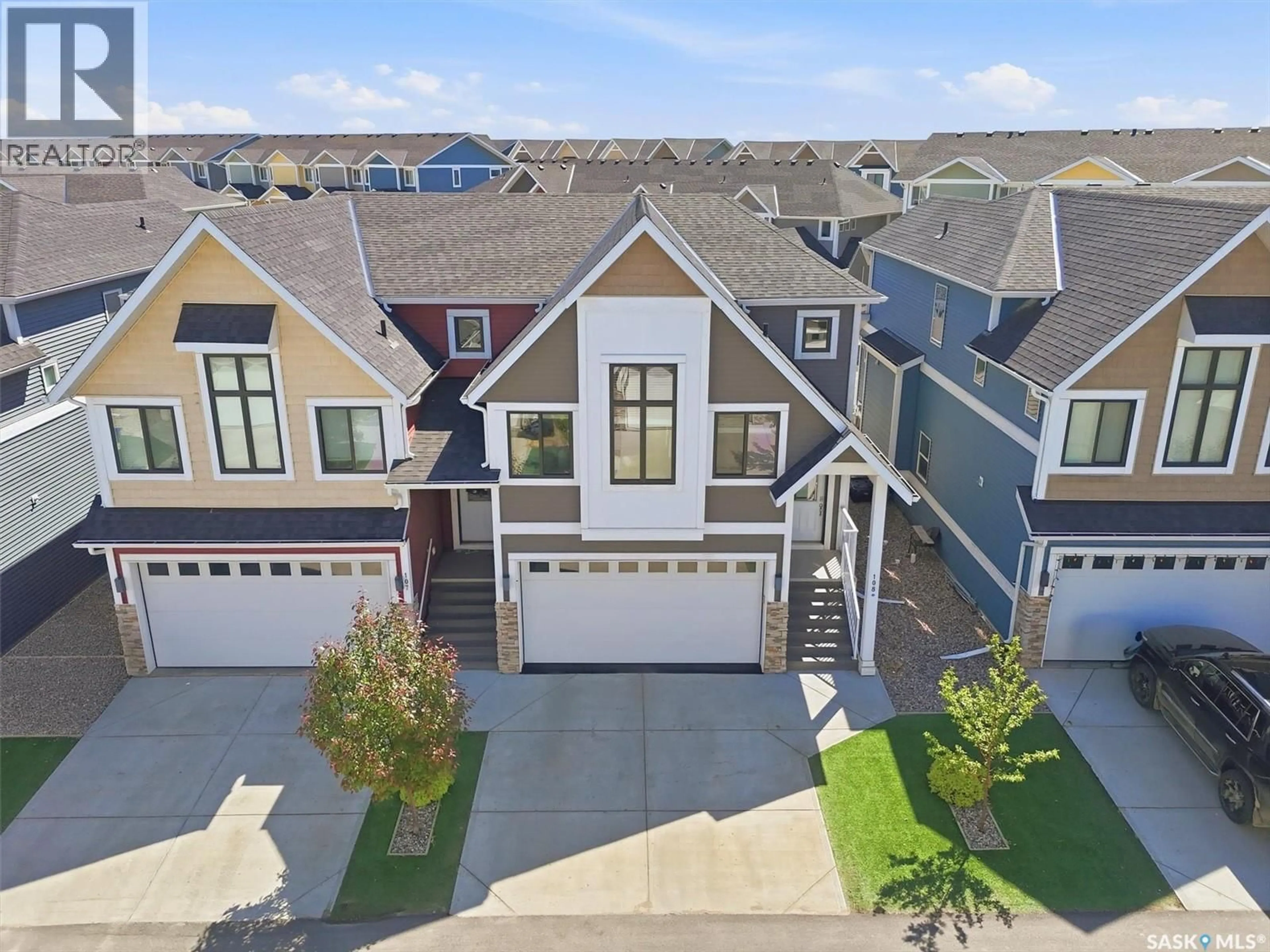 A pic from outside/outdoor area/front of a property/back of a property/a pic from drone, street for 108 900 ST ANDREWS LANE, Warman Saskatchewan S0K4S4