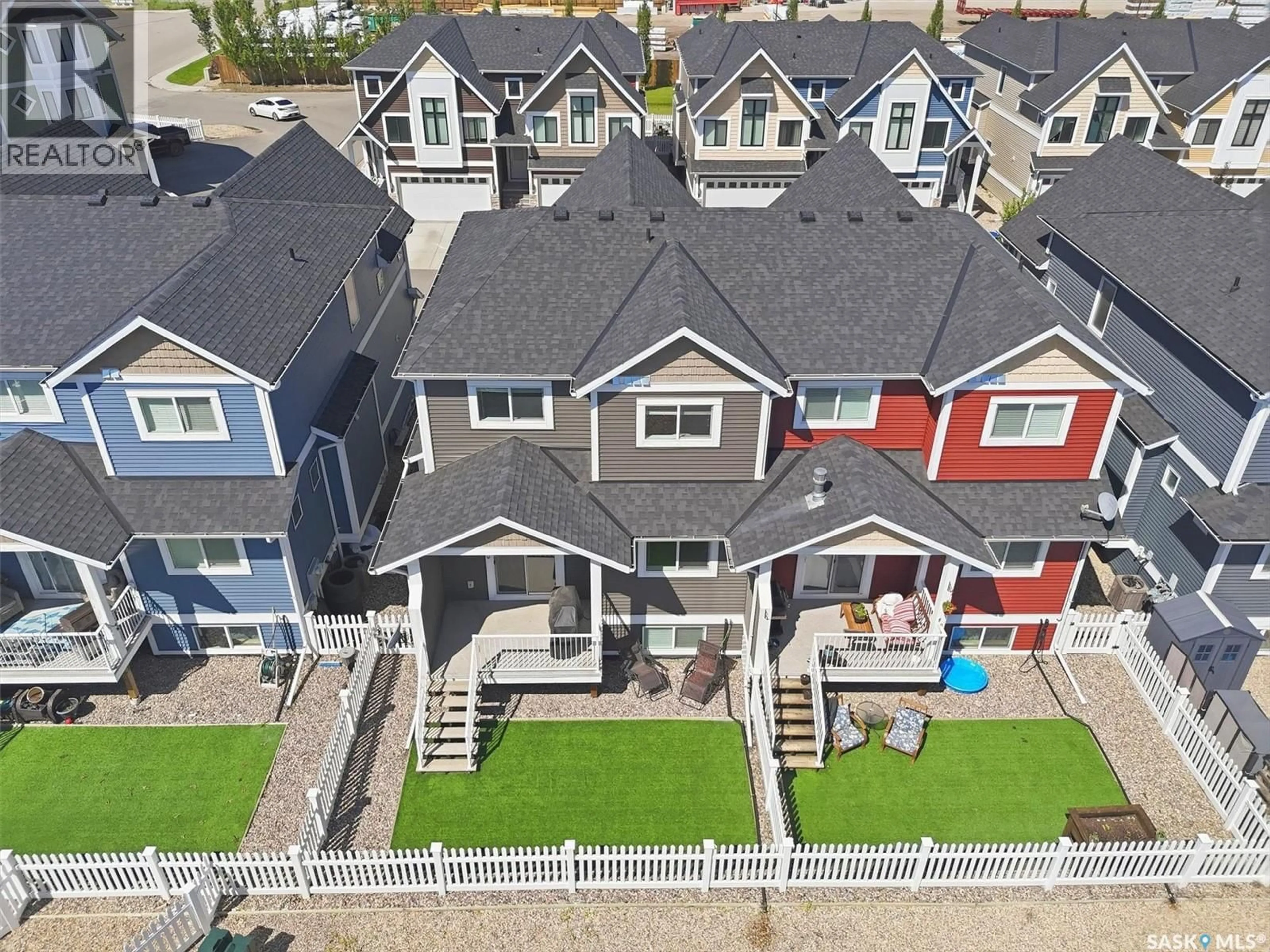 A pic from outside/outdoor area/front of a property/back of a property/a pic from drone, street for 108 900 ST ANDREWS LANE, Warman Saskatchewan S0K4S4