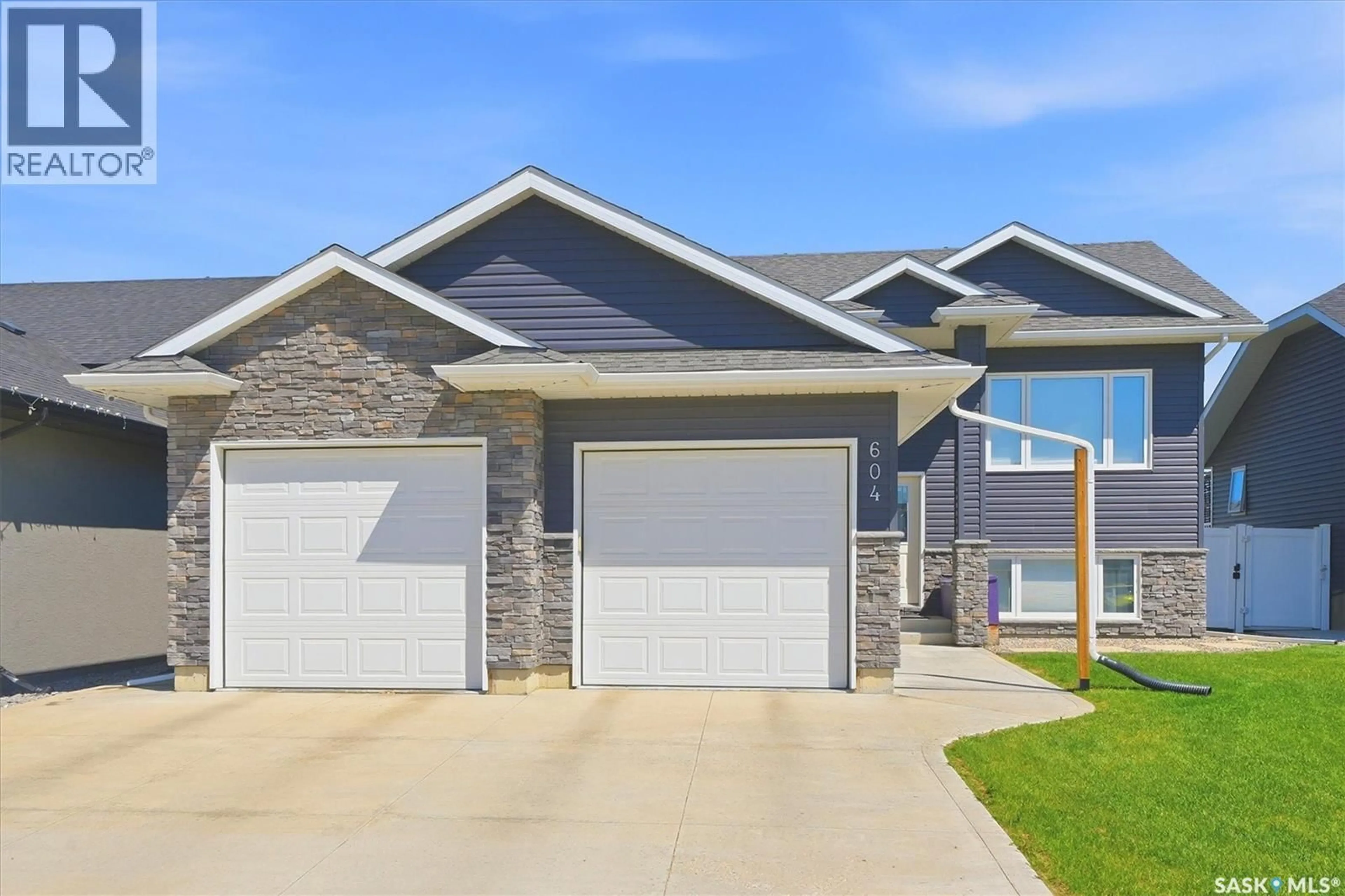 Home with vinyl exterior material, street for 604 PEBBLE BEACH BOULEVARD, Warman Saskatchewan S0K4S4