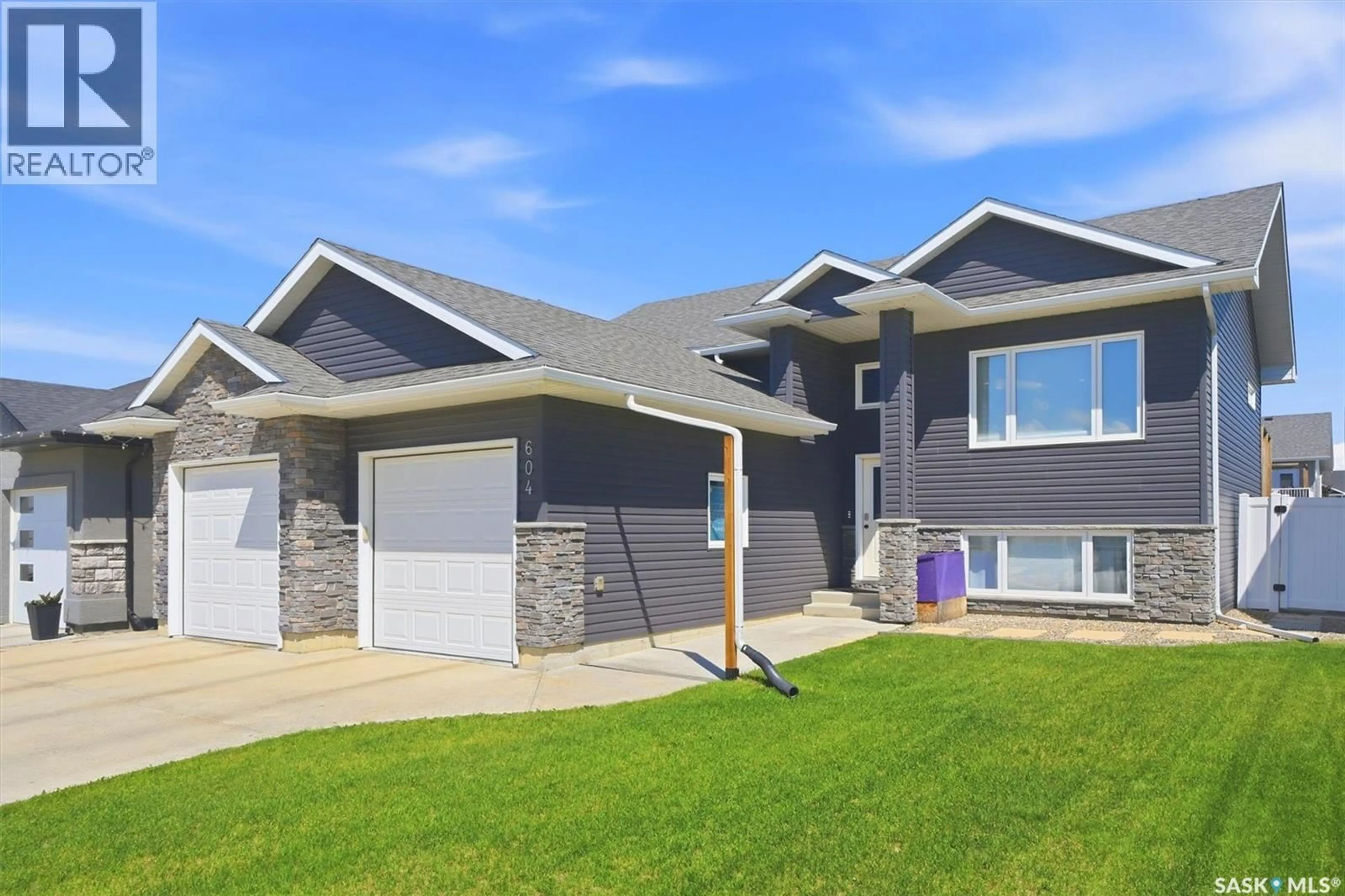 Home with vinyl exterior material, street for 604 PEBBLE BEACH BOULEVARD, Warman Saskatchewan S0K4S4