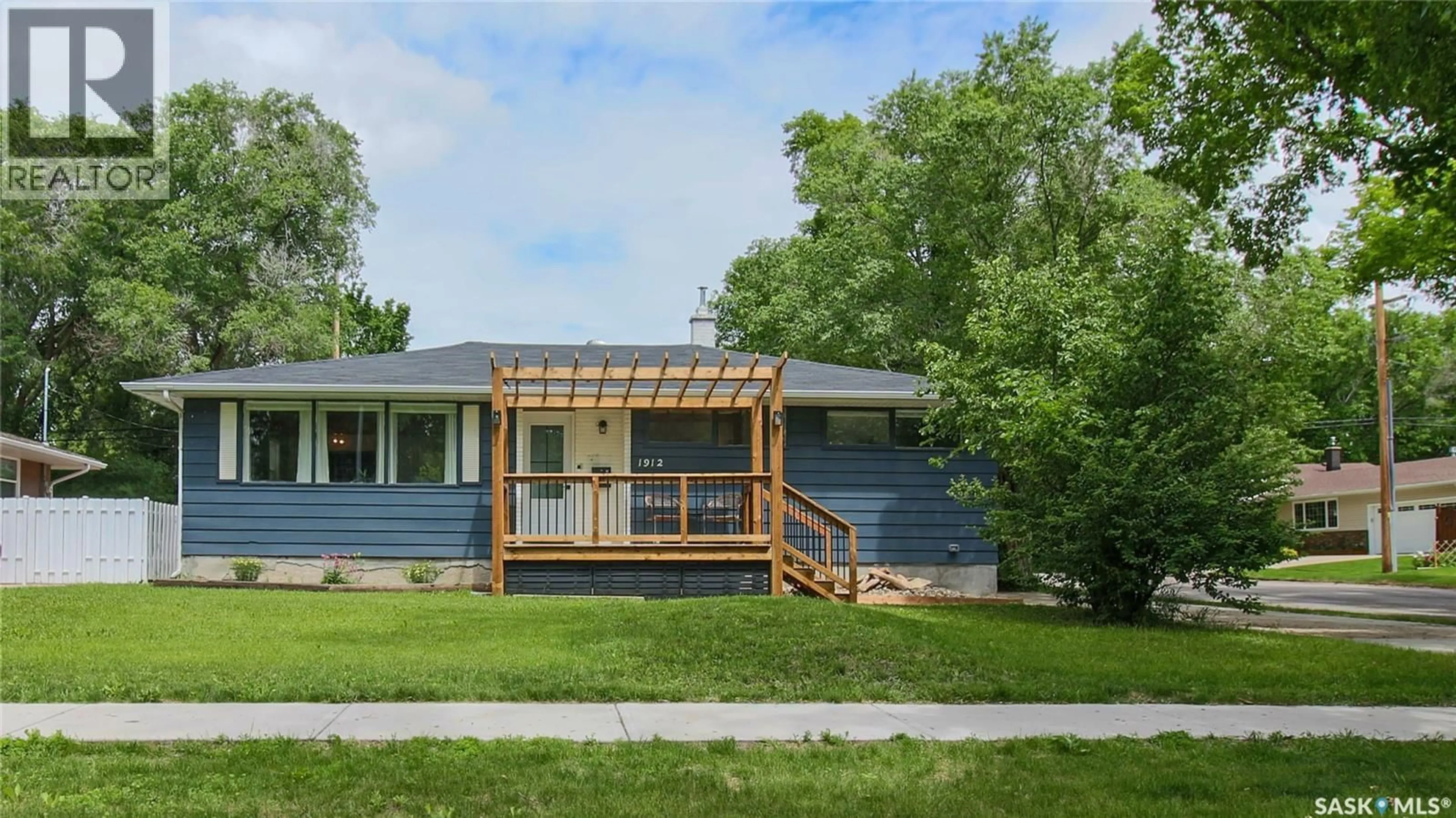 Home with vinyl exterior material, street for 1912 GRANT DRIVE, Regina Saskatchewan S4S4V6