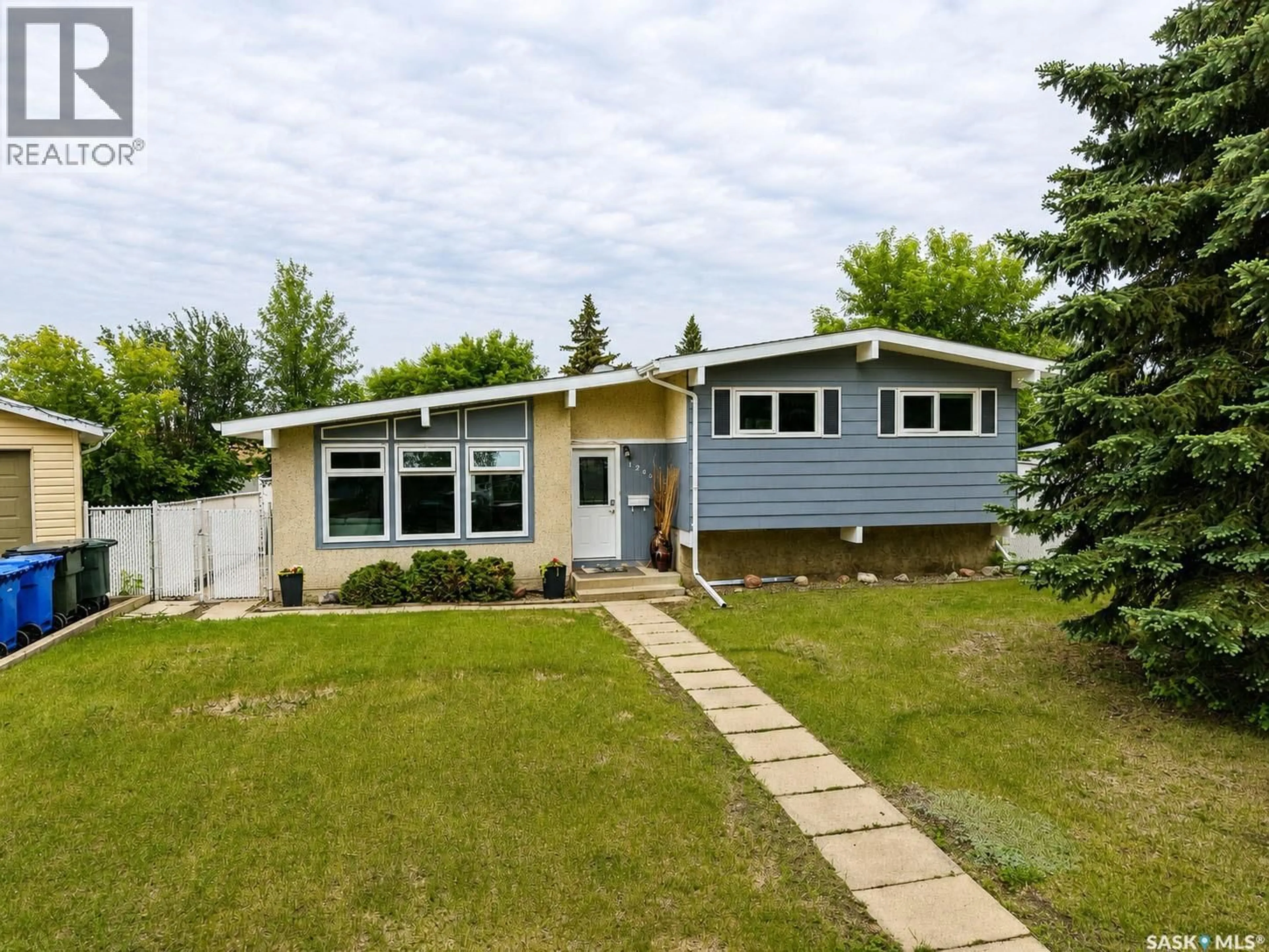 Home with vinyl exterior material, street for 1269 GILLMOR CRESCENT, Prince Albert Saskatchewan S6V6A8