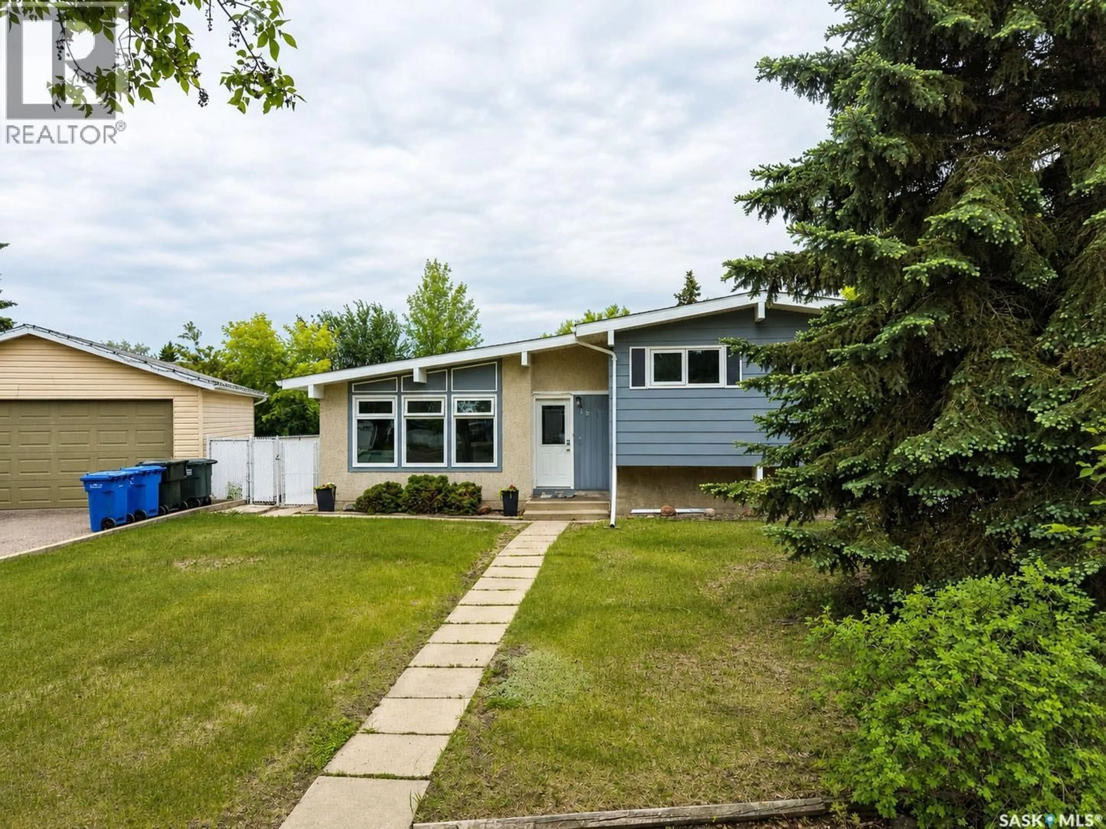 Home with vinyl exterior material, street for 1269 GILLMOR CRESCENT, Prince Albert Saskatchewan S6V6A8
