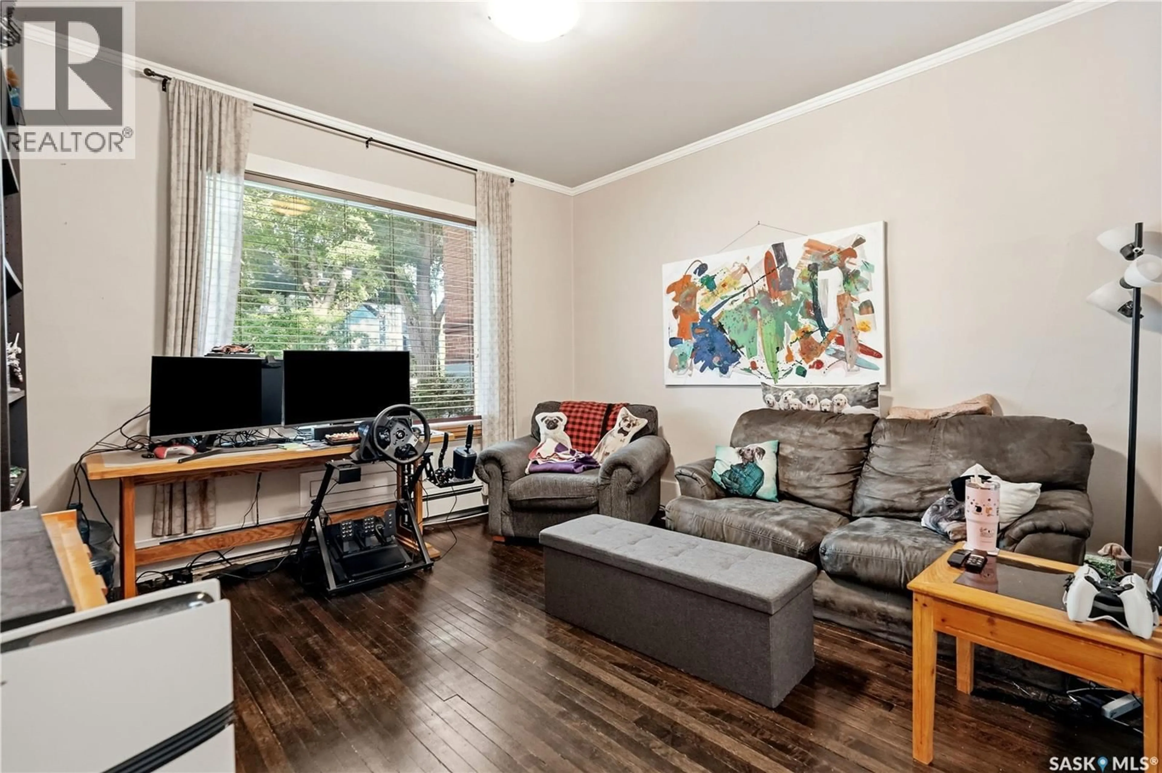 Living room with furniture, wood/laminate floor for 2070 GARNET STREET, Regina Saskatchewan S4T2Z6
