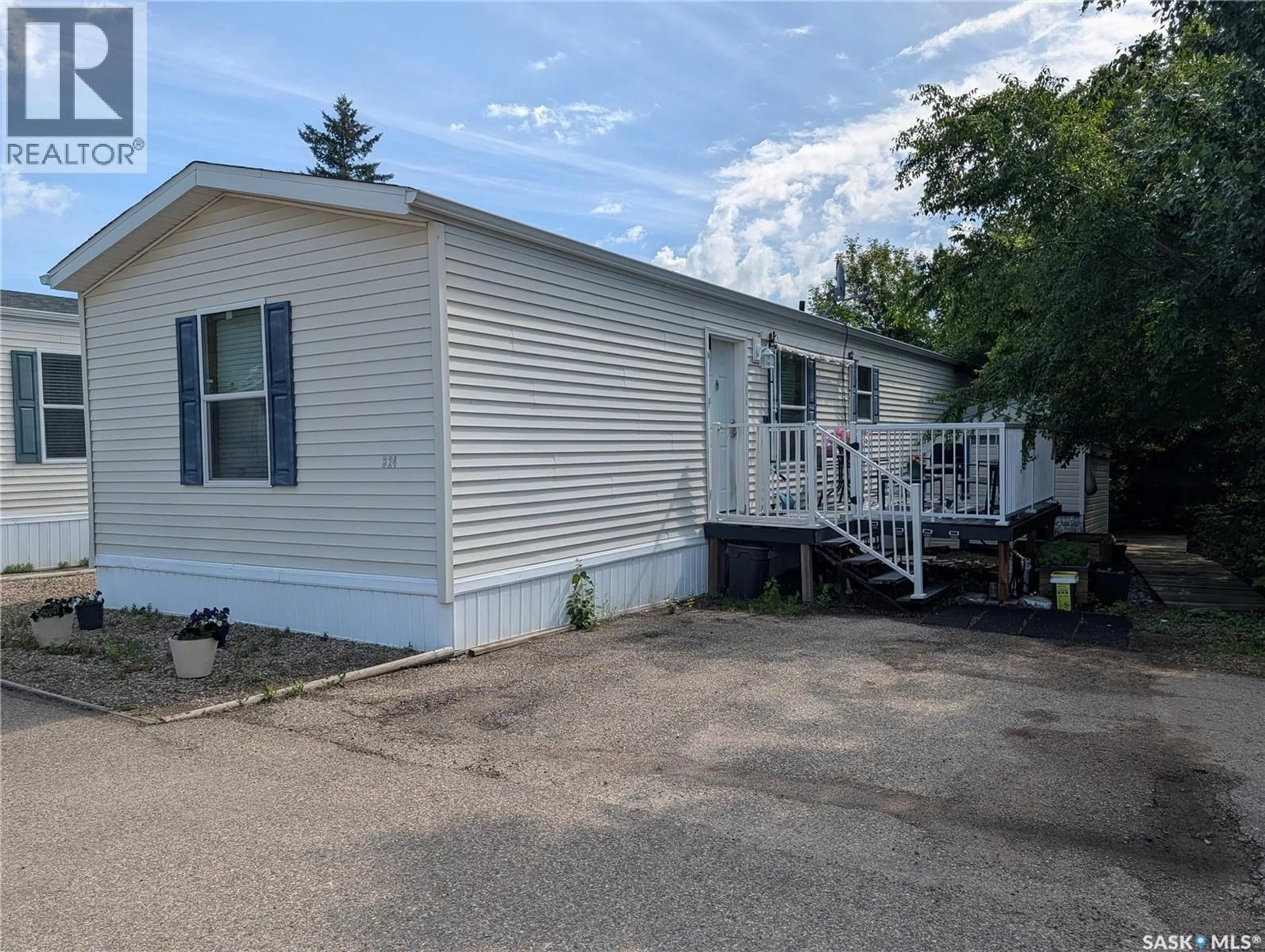 Home with vinyl exterior material, street for B24 - 1295 9TH AVENUE NE, Moose Jaw Saskatchewan S6J1C5