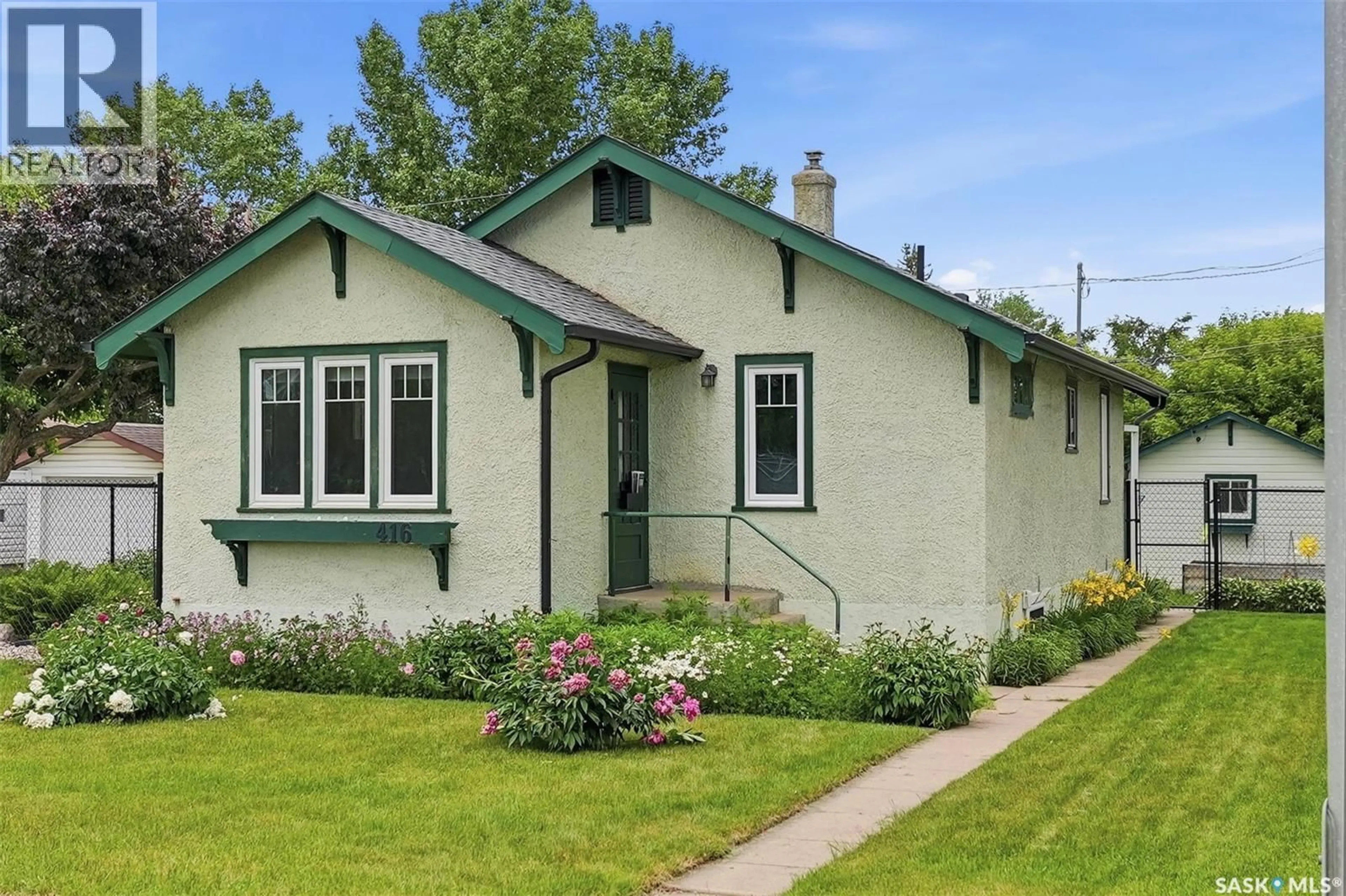 Home with vinyl exterior material, street for 416 22ND STREET, Prince Albert Saskatchewan S6V4K6