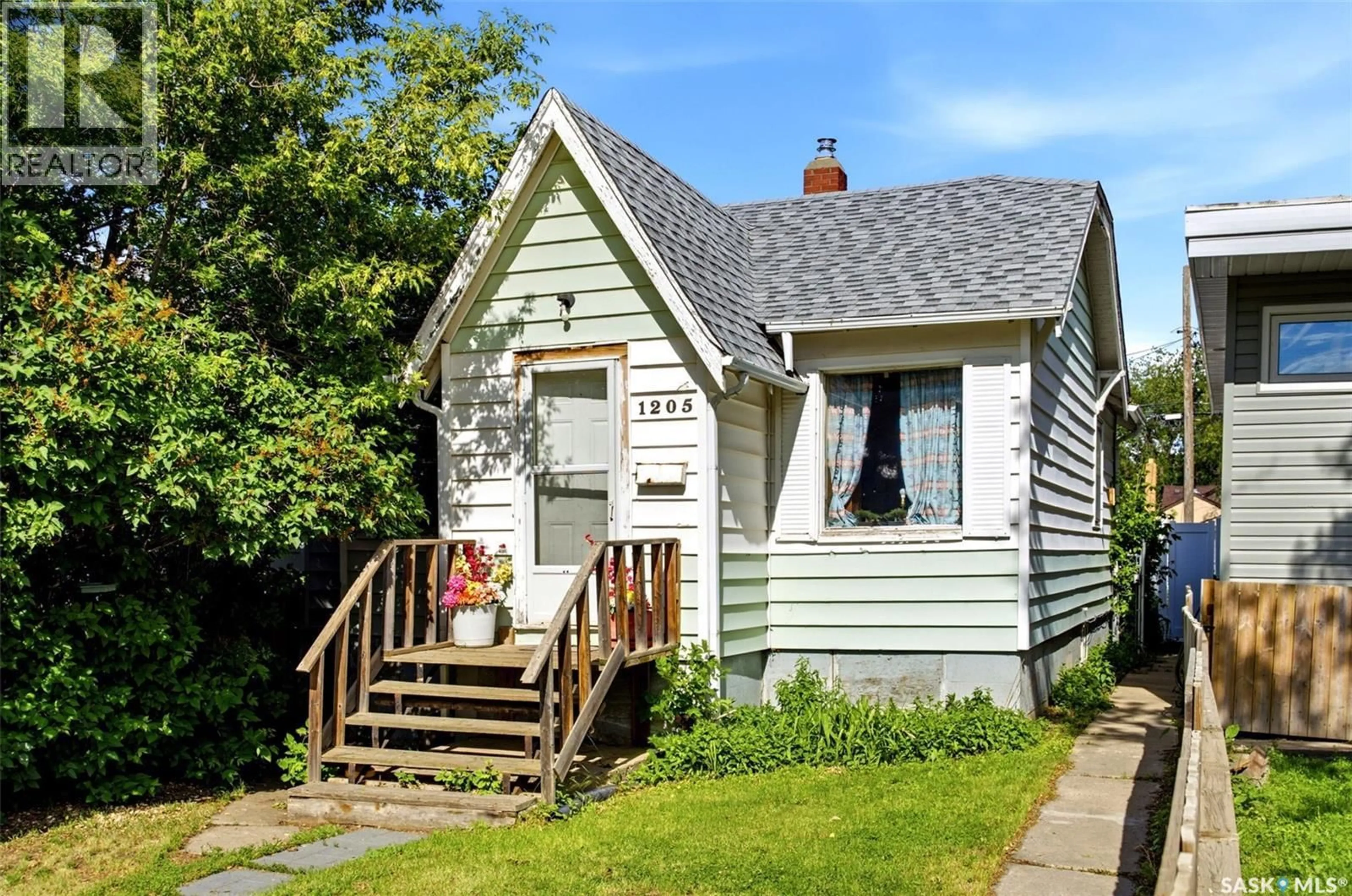 Home with vinyl exterior material, street for 1205 MCTAVISH STREET, Regina Saskatchewan S4T3V8