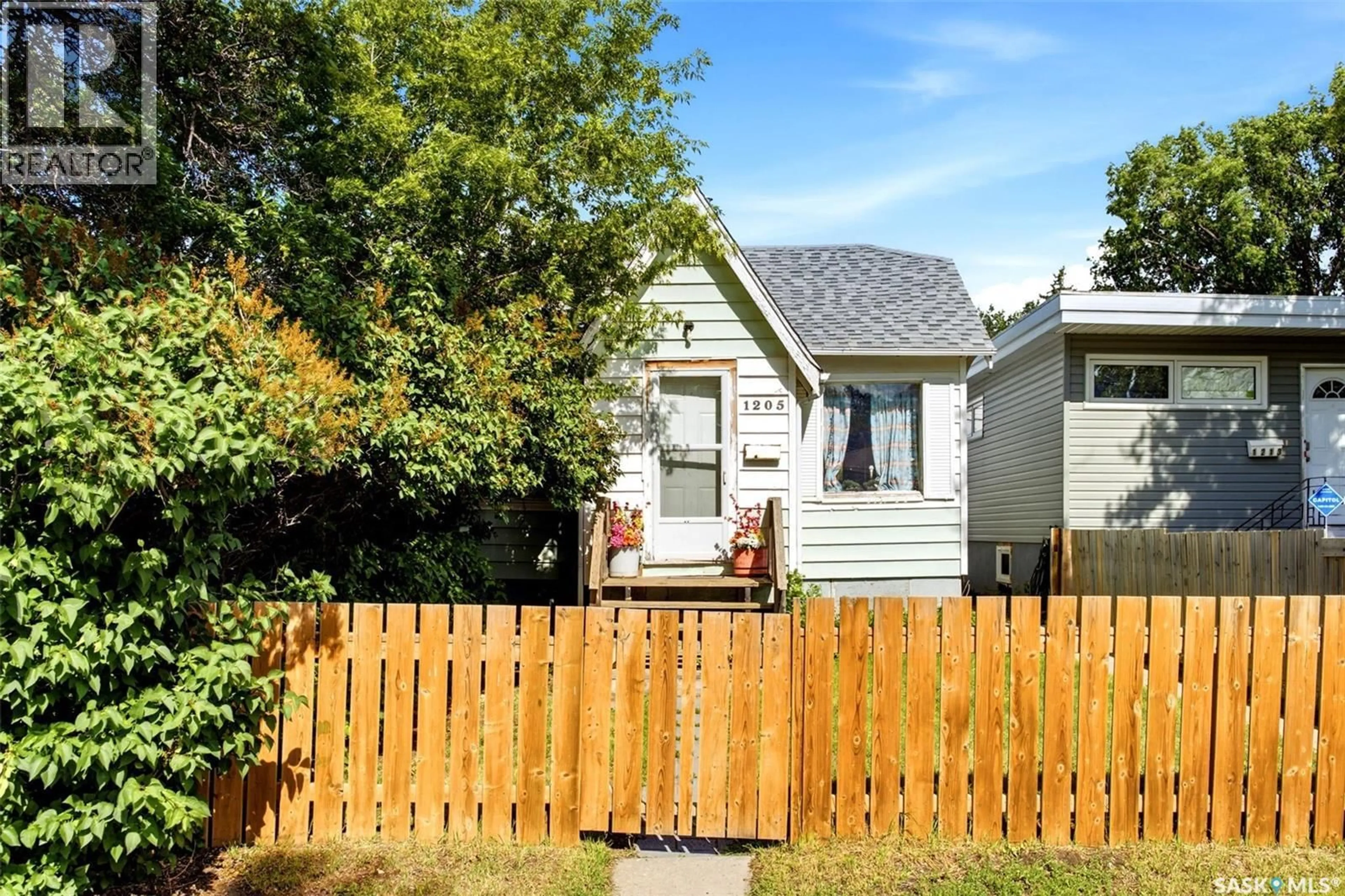 Home with vinyl exterior material, street for 1205 MCTAVISH STREET, Regina Saskatchewan S4T3V8