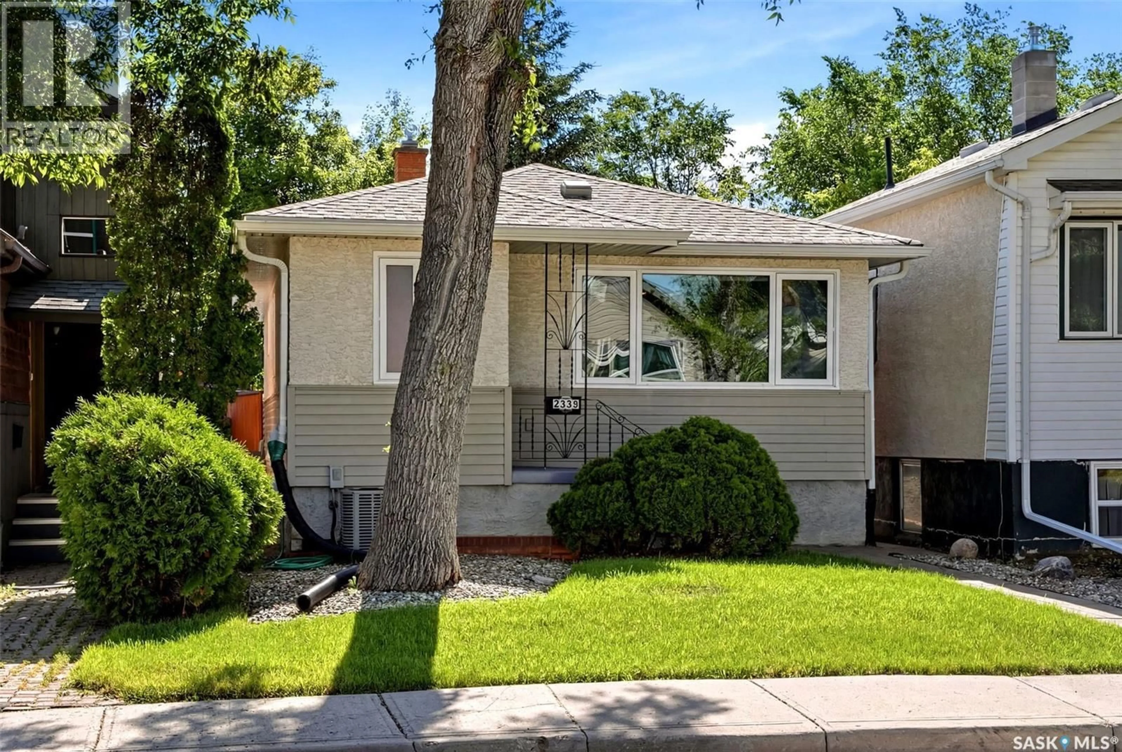 Home with vinyl exterior material, street for 2339 REYNOLDS STREET, Regina Saskatchewan S4N3N6