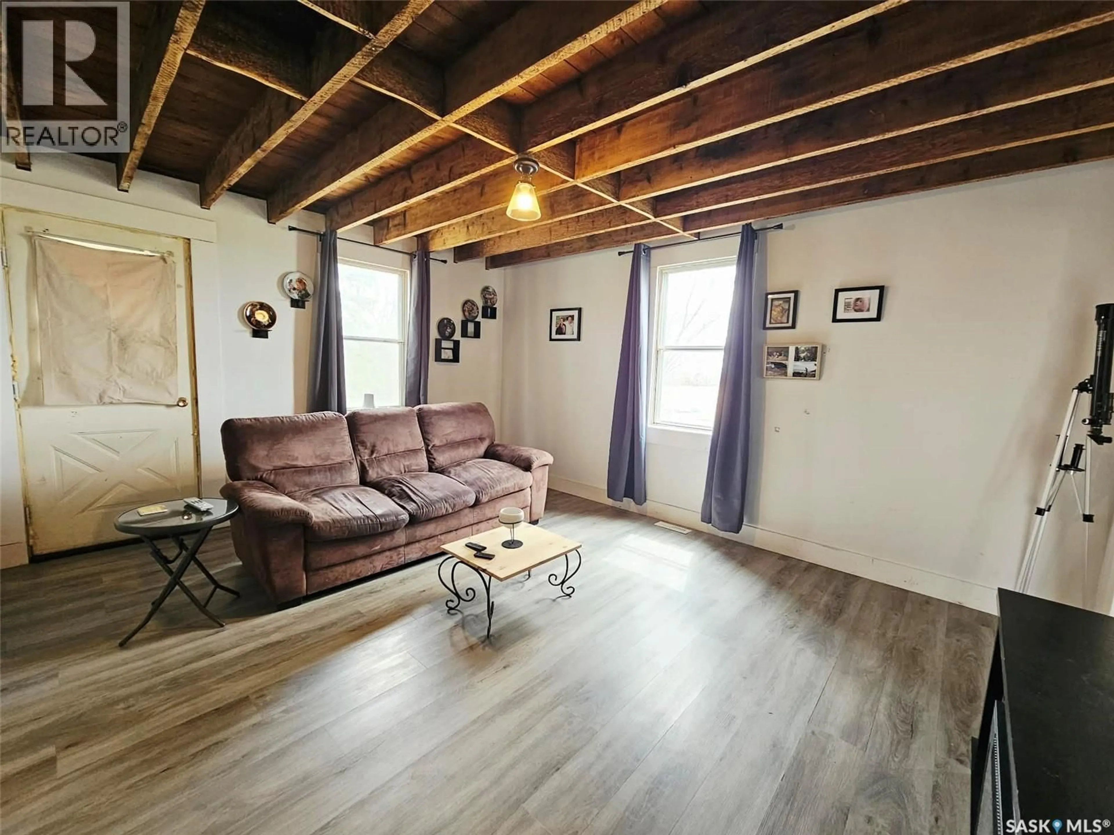 Living room with furniture, wood/laminate floor for FOWLER ACREAGE, Langenburg Rm No. 181 Saskatchewan S0A2A0