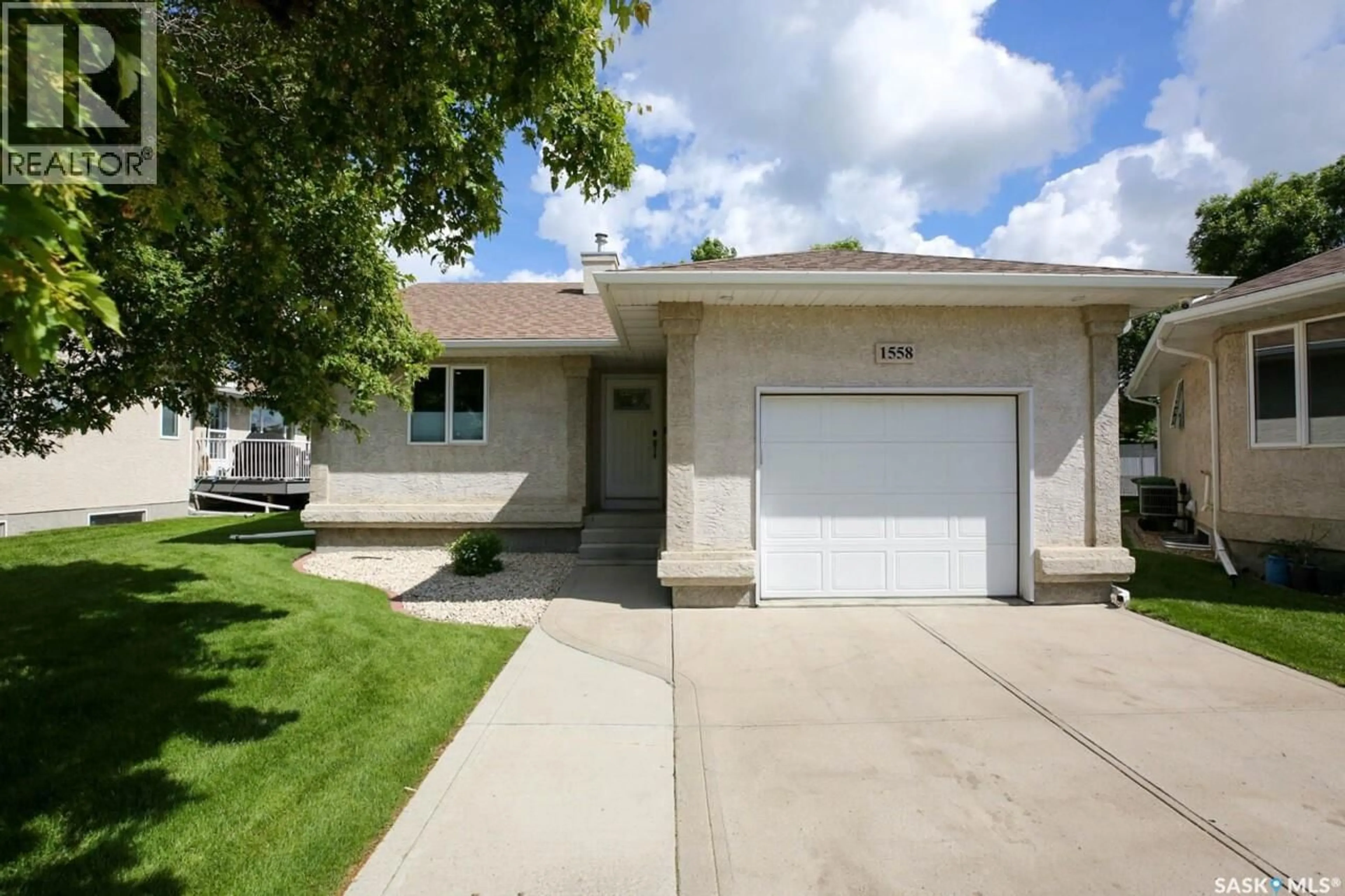 Home with vinyl exterior material, street for E - 1558 DEWDNEY BAY, Regina Saskatchewan S4Z1A7