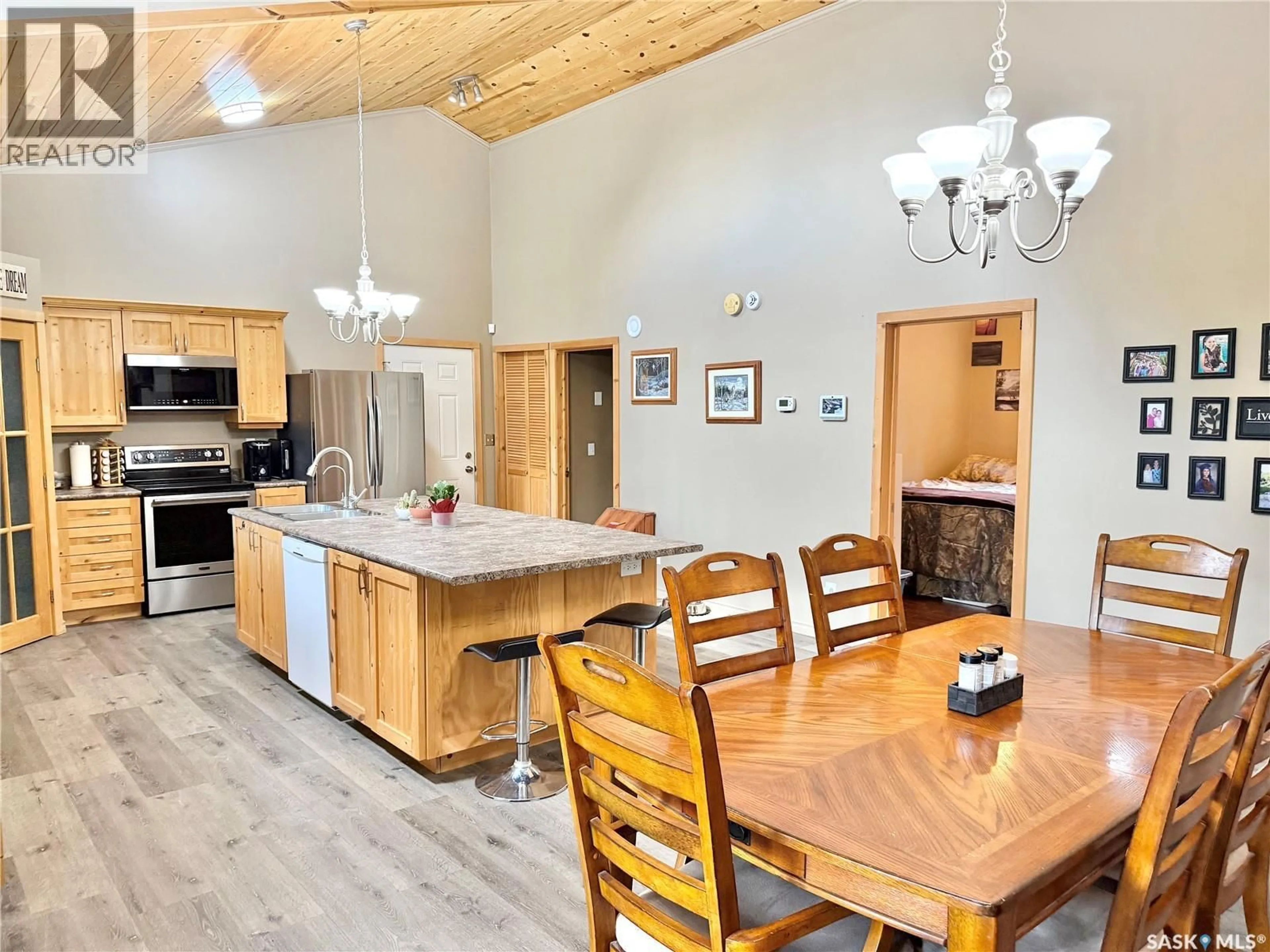 Open concept kitchen, wood/laminate floor for 106 DOUGAN COURT, Chitek Lake Saskatchewan S0J0L0