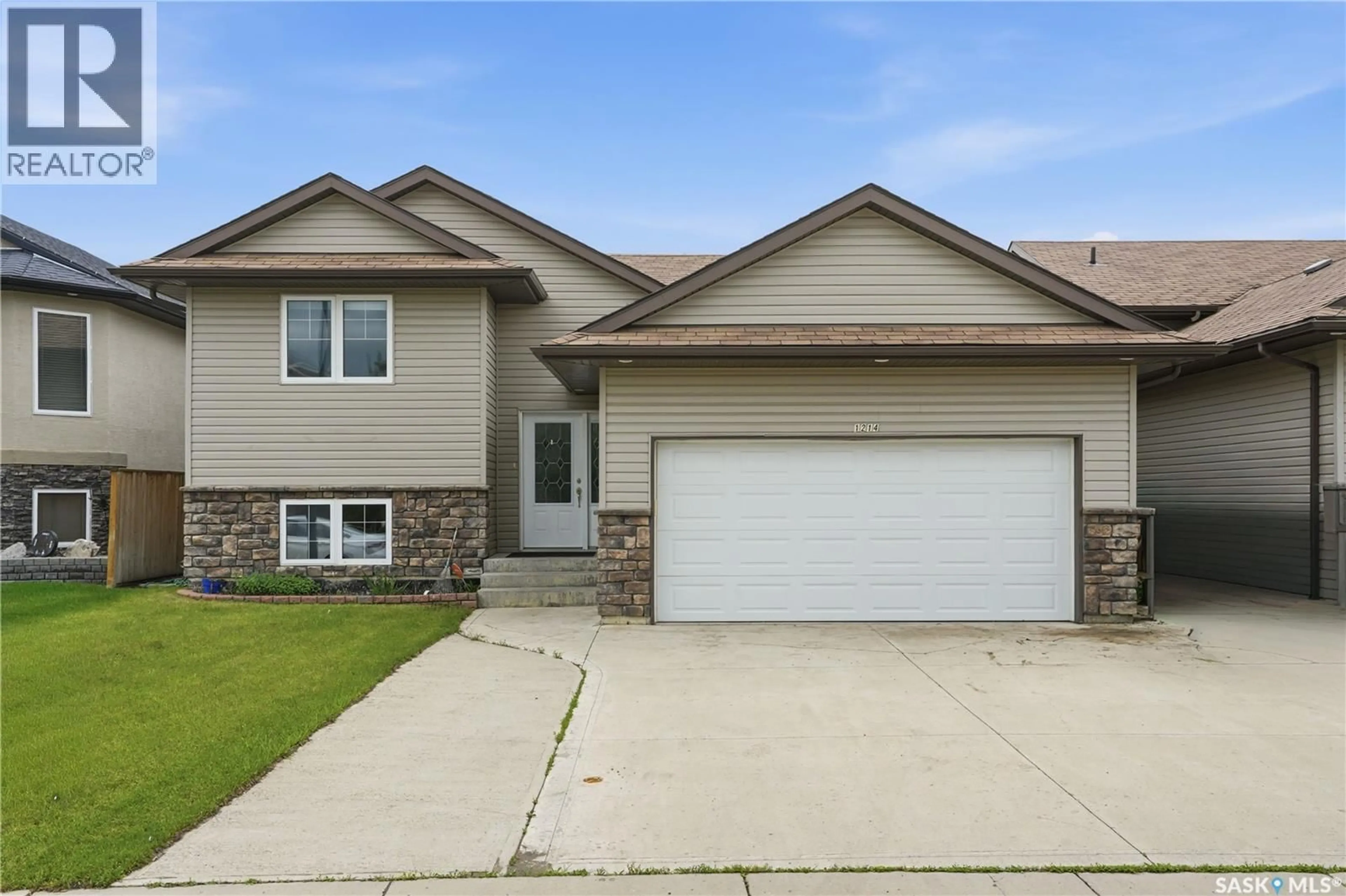 Home with vinyl exterior material, street for 1214 WILLOWGROVE COURT, Saskatoon Saskatchewan S7W0A8
