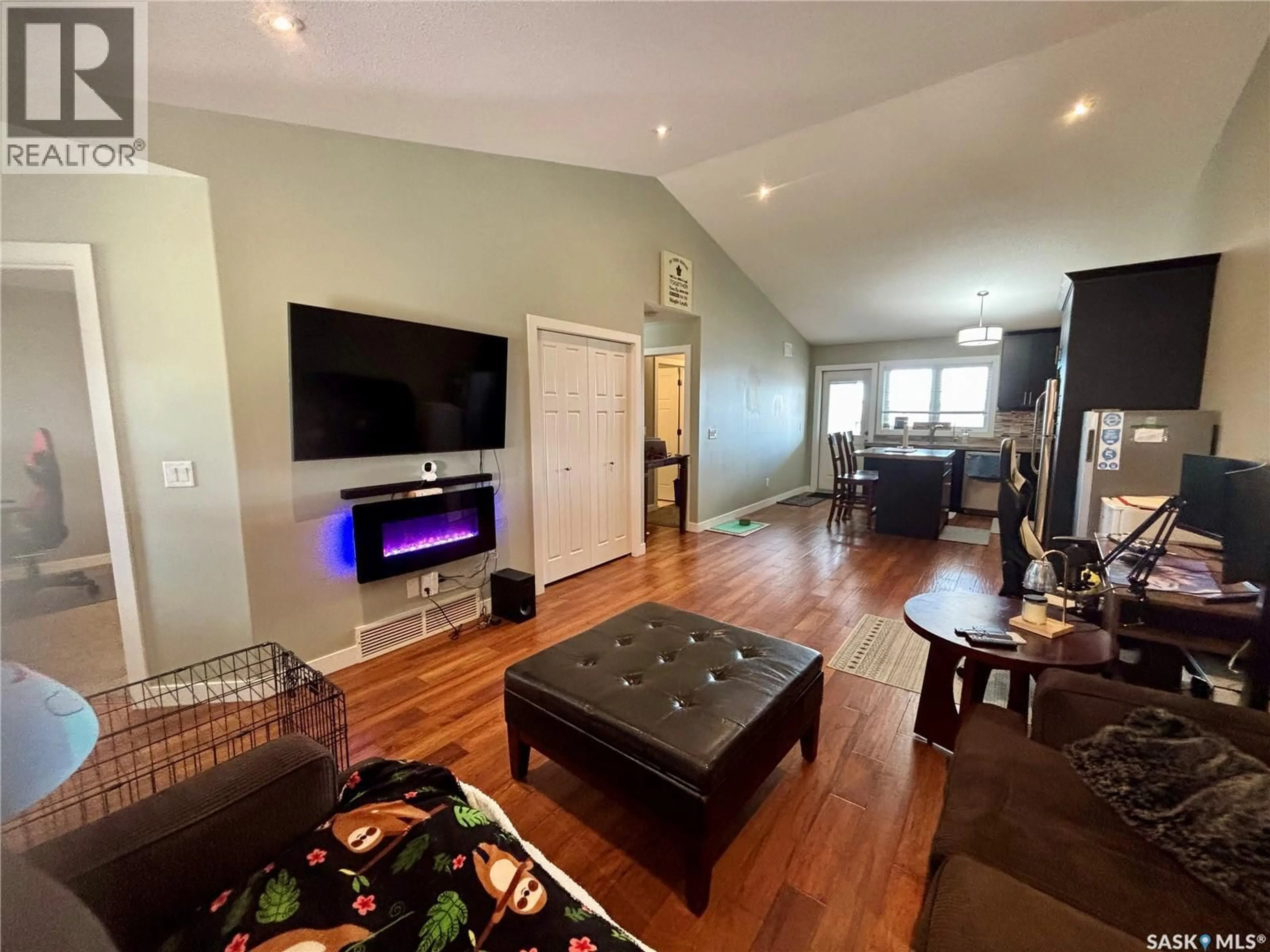 Living room with furniture, wood/laminate floor for 4107 GREEN APPLE DRIVE, Regina Saskatchewan S4V1S1