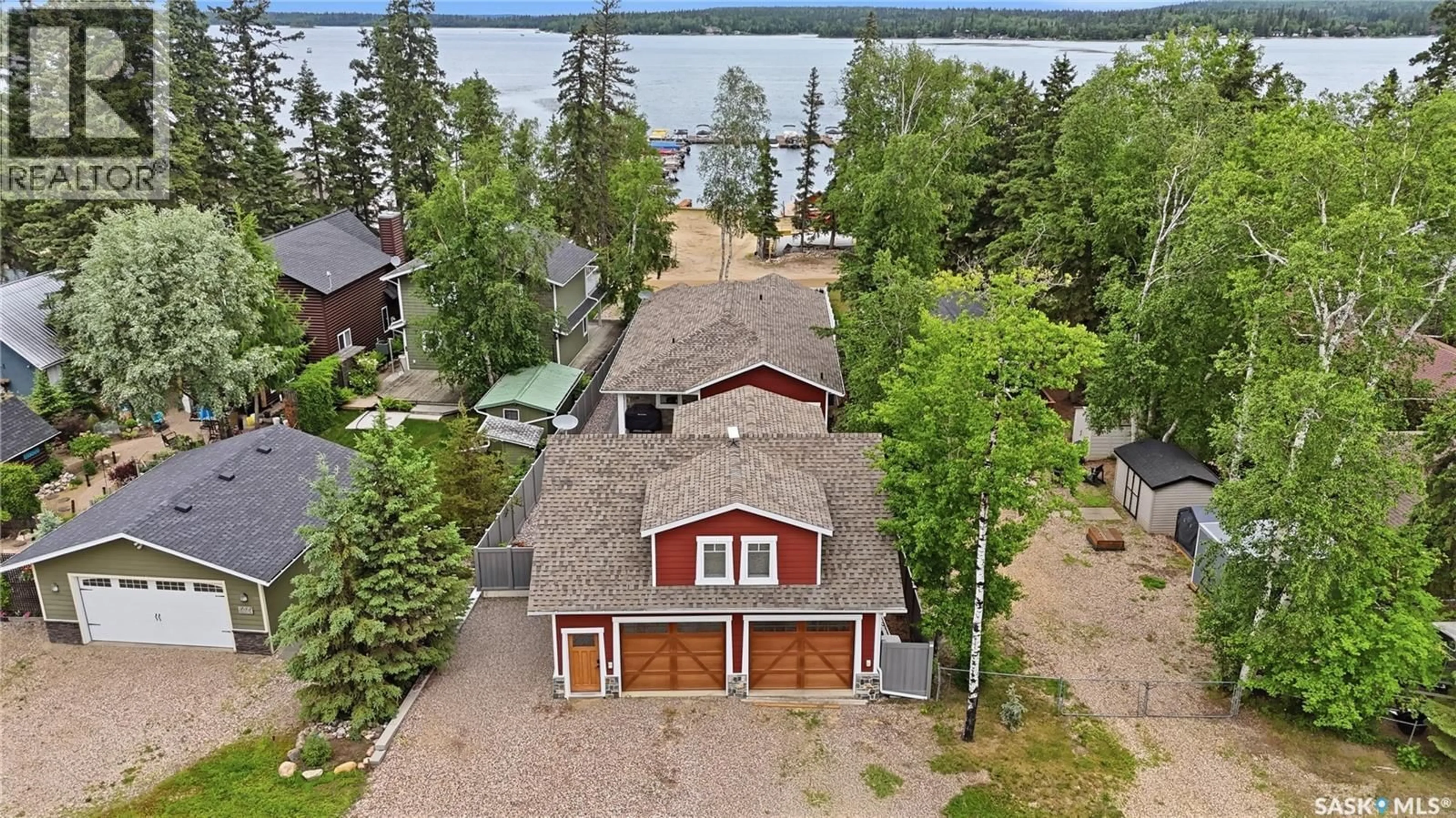A pic from outside/outdoor area/front of a property/back of a property/a pic from drone, water/lake/river/ocean view for 251 LAKESHORE DRIVE, Emma Lake Saskatchewan S0J0N0