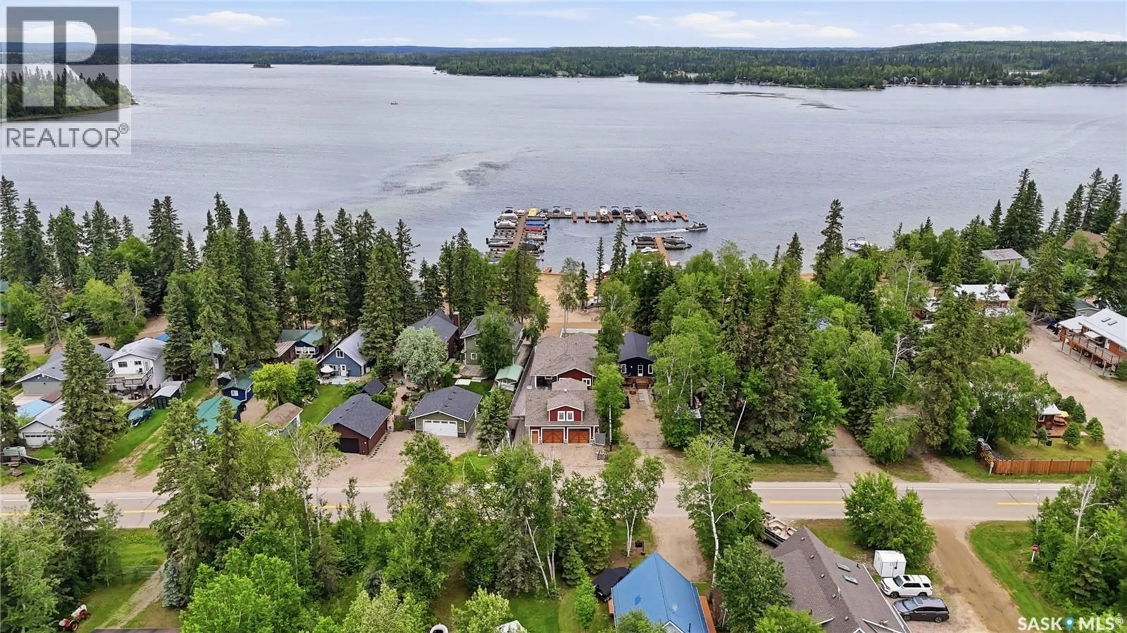 A pic from outside/outdoor area/front of a property/back of a property/a pic from drone, water/lake/river/ocean view for 251 LAKESHORE DRIVE, Emma Lake Saskatchewan S0J0N0