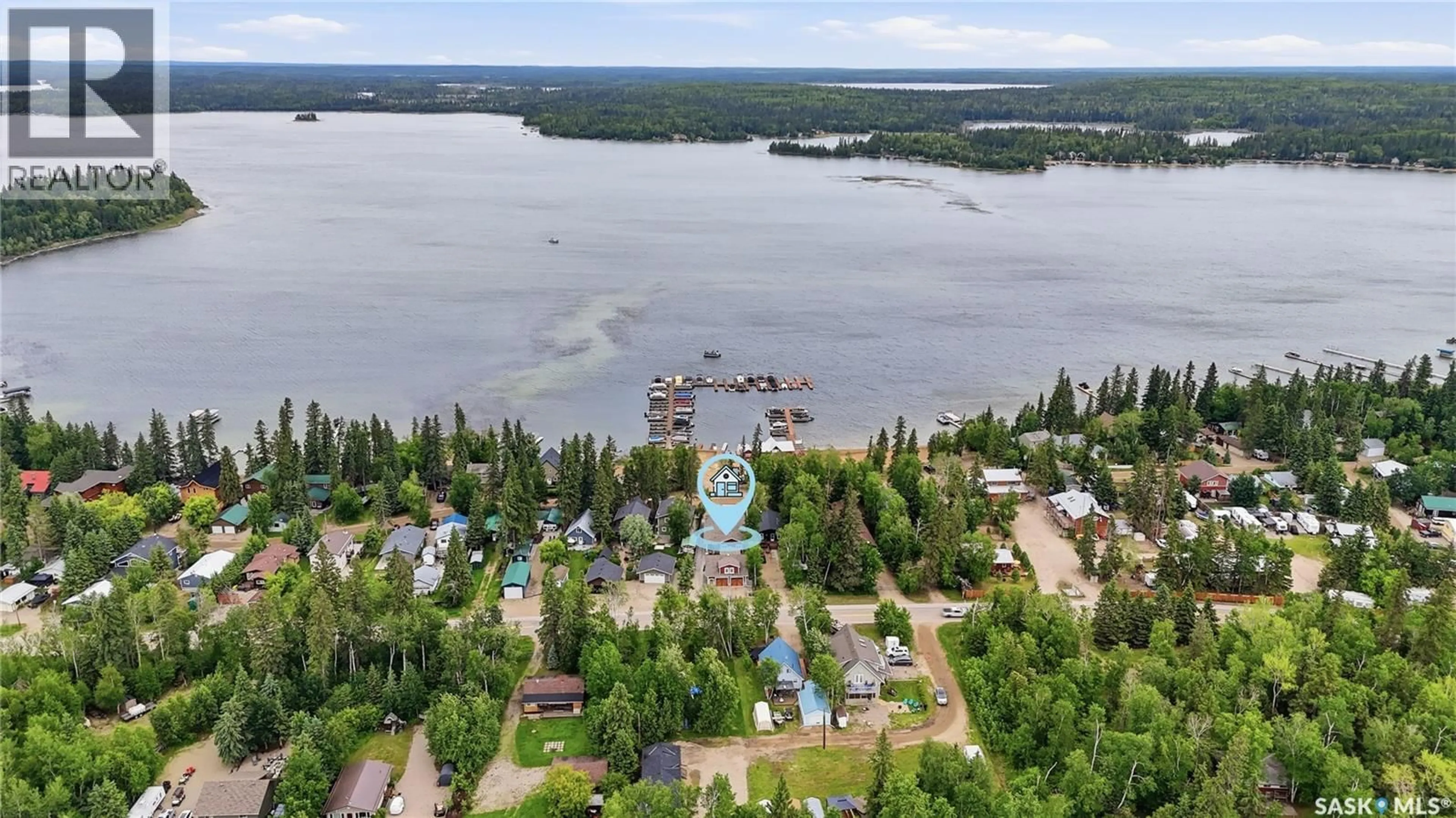 A pic from outside/outdoor area/front of a property/back of a property/a pic from drone, water/lake/river/ocean view for 251 LAKESHORE DRIVE, Emma Lake Saskatchewan S0J0N0