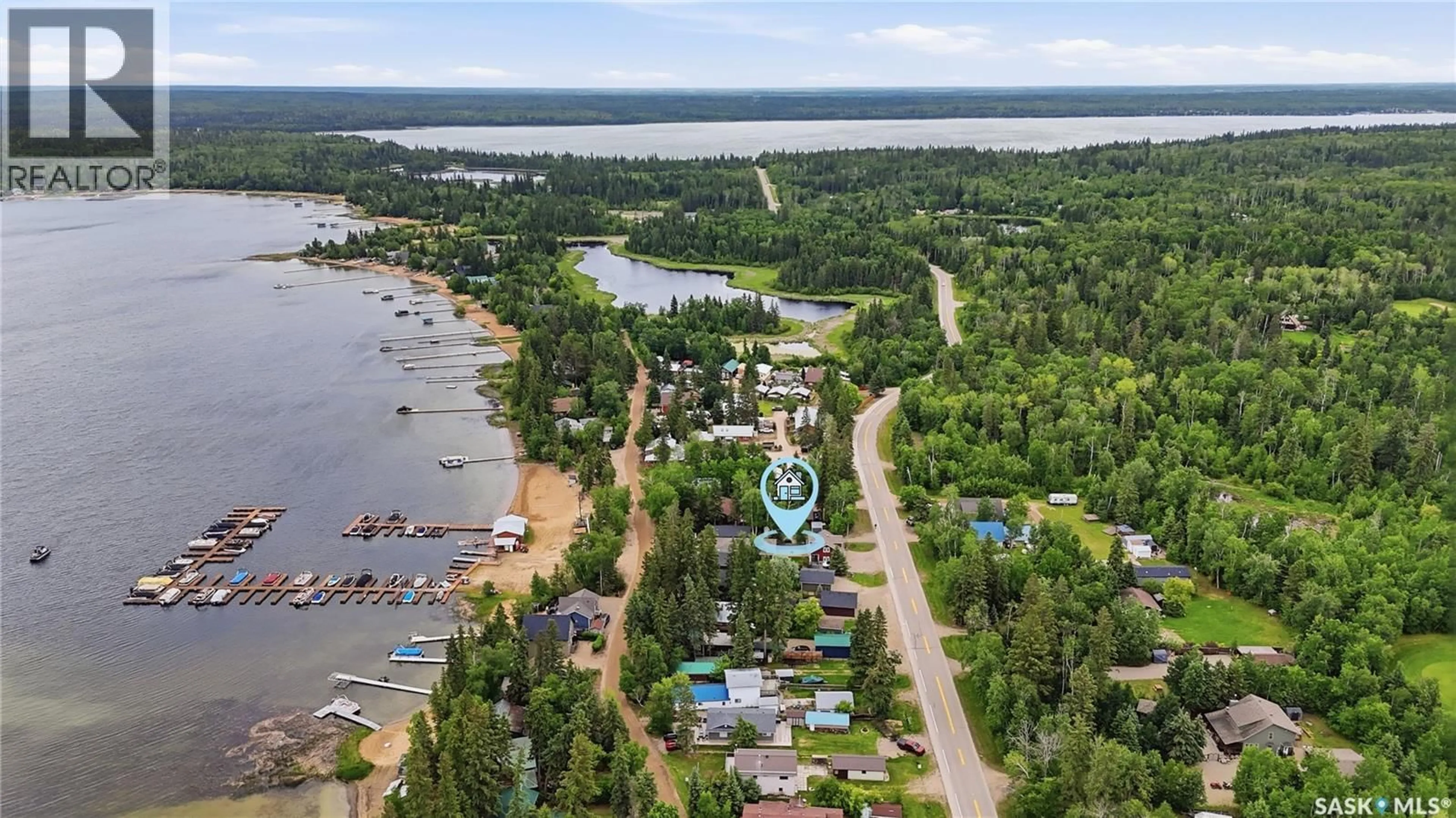 A pic from outside/outdoor area/front of a property/back of a property/a pic from drone, water/lake/river/ocean view for 251 LAKESHORE DRIVE, Emma Lake Saskatchewan S0J0N0