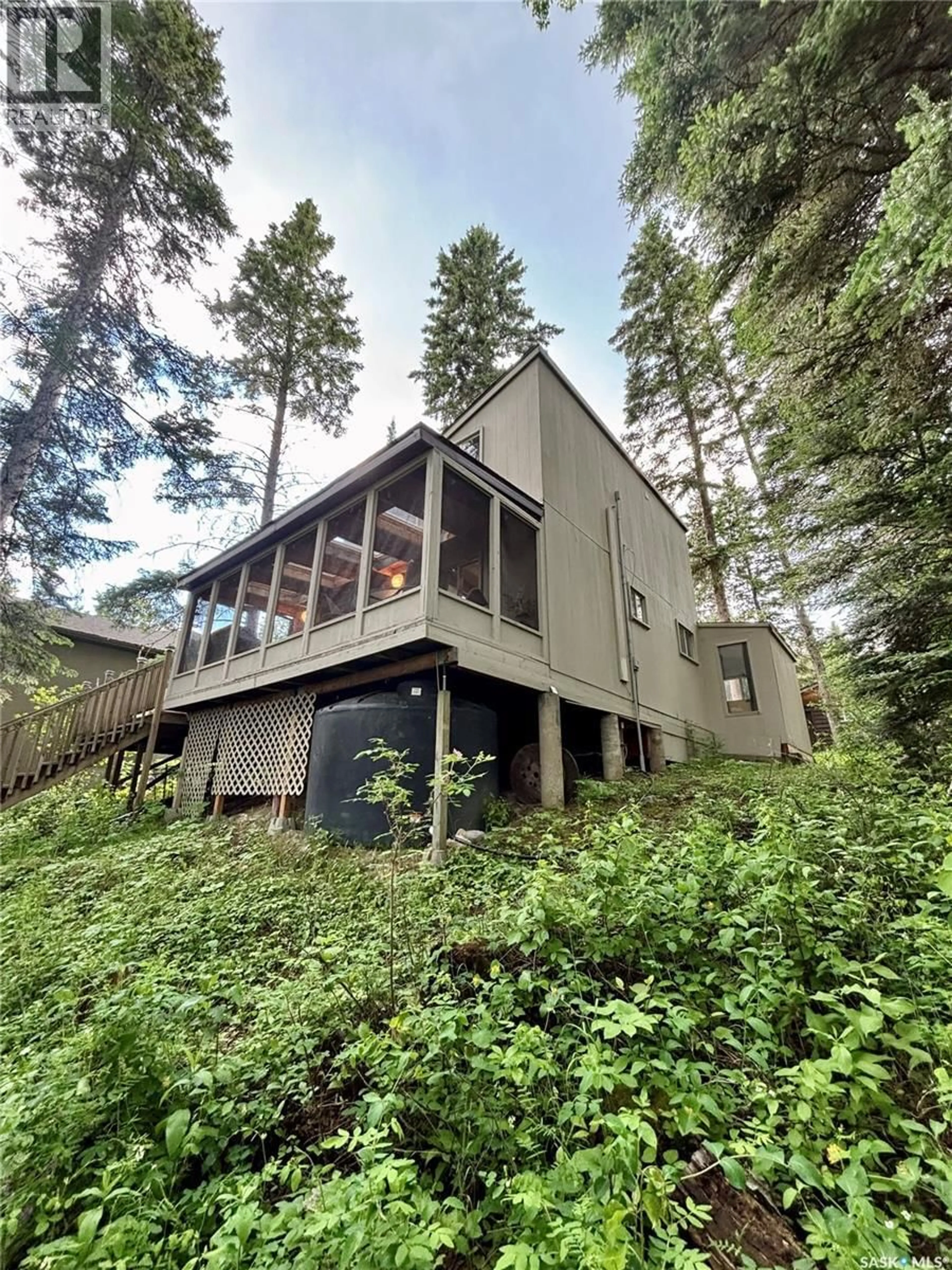 Home with vinyl exterior material, forest/trees view for McPhee Lake - BEAVER-LAKEFRONT, McPhee Lake Saskatchewan S0J0N0
