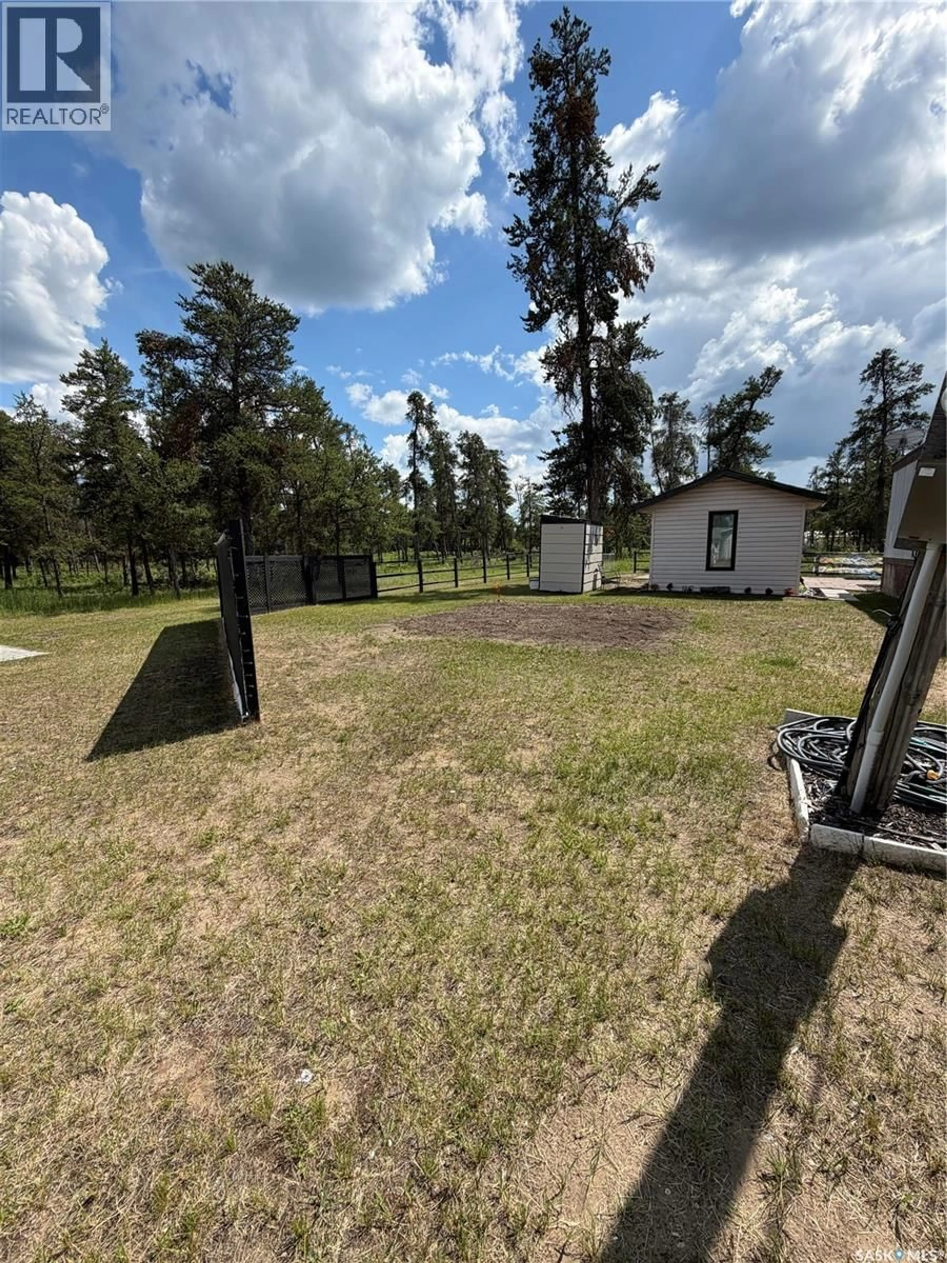A pic from outside/outdoor area/front of a property/back of a property/a pic from drone, forest/trees view for 96 STARLITE TRAILER COURT, Hudson Bay Rm No. 394 Saskatchewan S0E0Y0