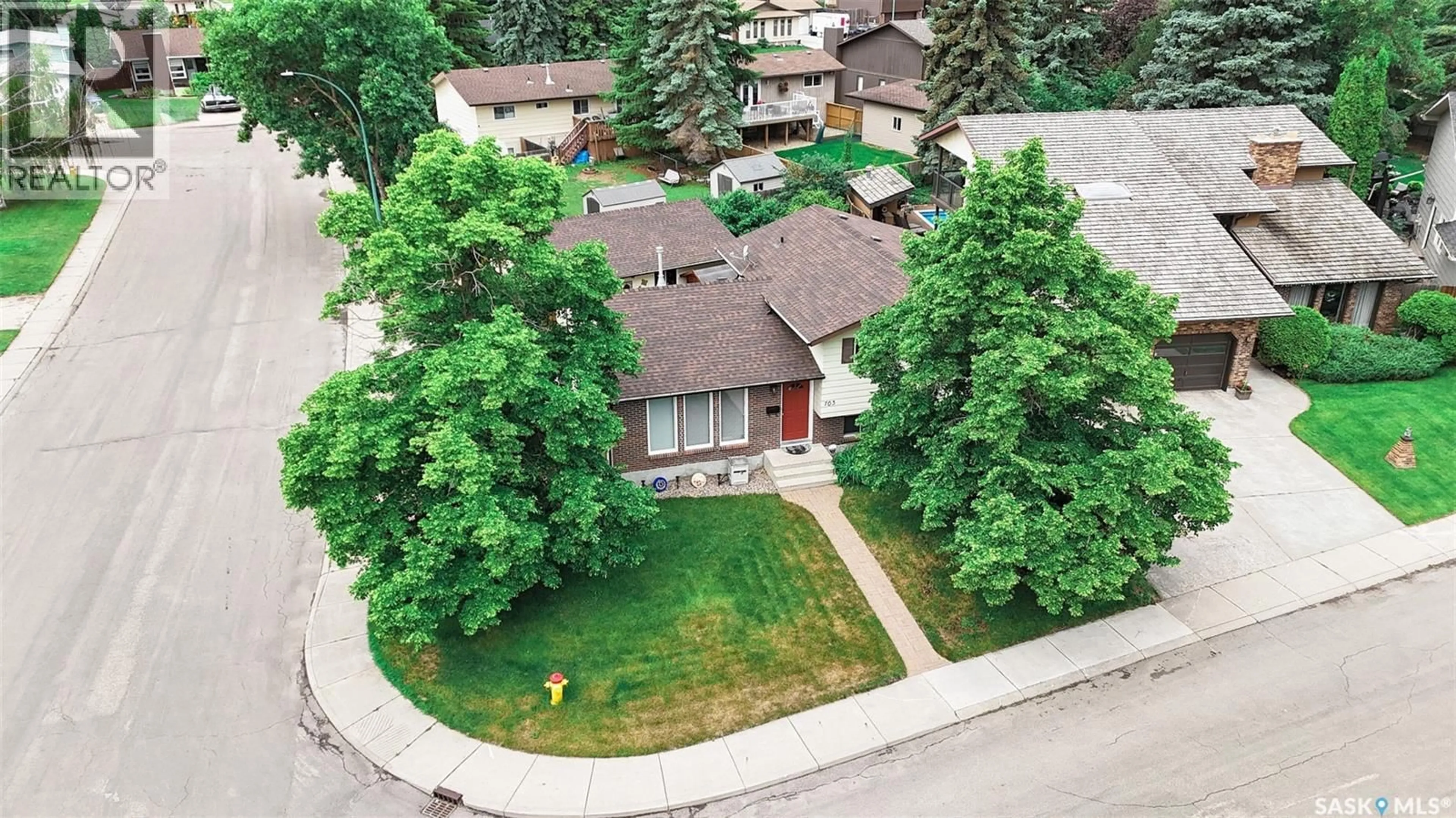 A pic from outside/outdoor area/front of a property/back of a property/a pic from drone, street for 703 CANDLE COURT, Saskatoon Saskatchewan S7K4Z9
